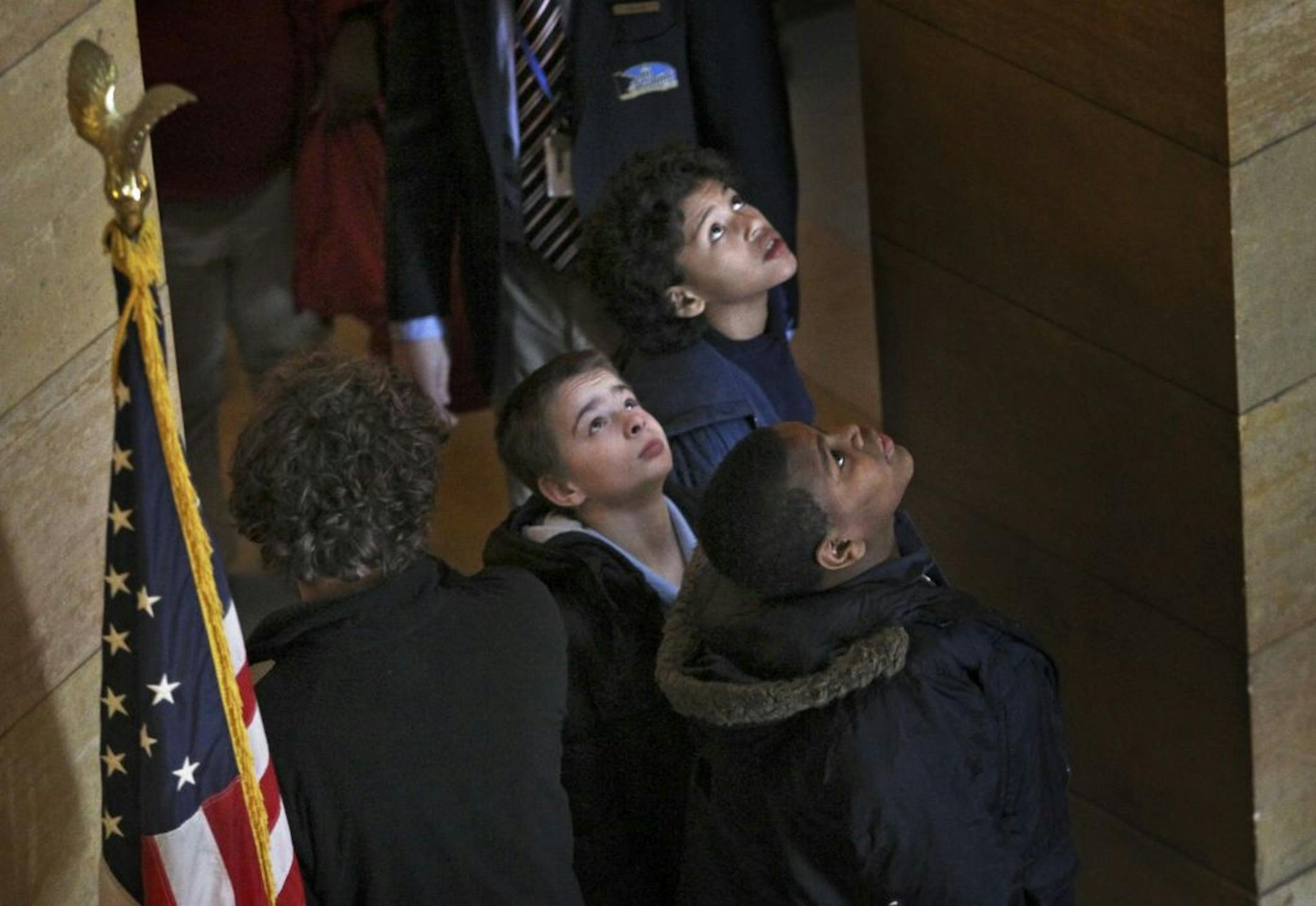 Students from Obama Elementary in St. Paul took in the ceiling murals while touring the Capitol on Monday.