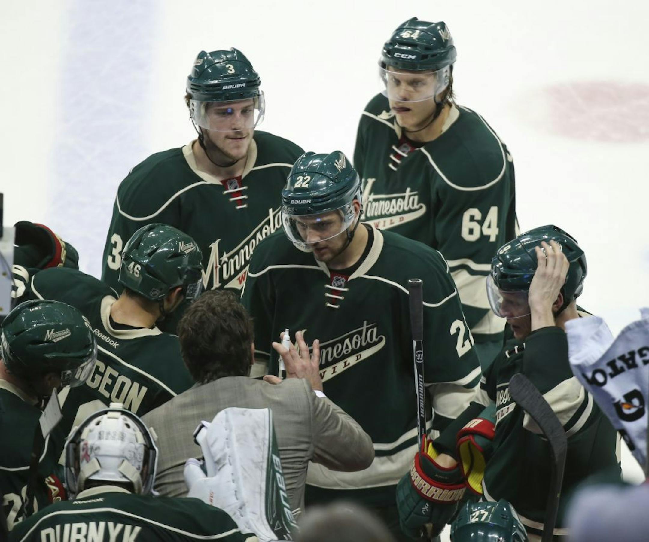 Wild assistant coach Andrew Brunette talked to players during a timeout late in the third period. Brunette scored an overtime goal against Colorado in Game 7 in 2003.