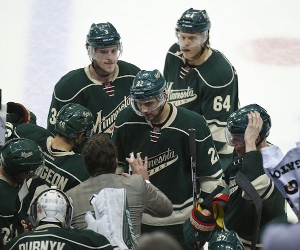 Wild assistant coach Andrew Brunette talked to players during a timeout late in the third period. Brunette scored an overtime goal against Colorado in