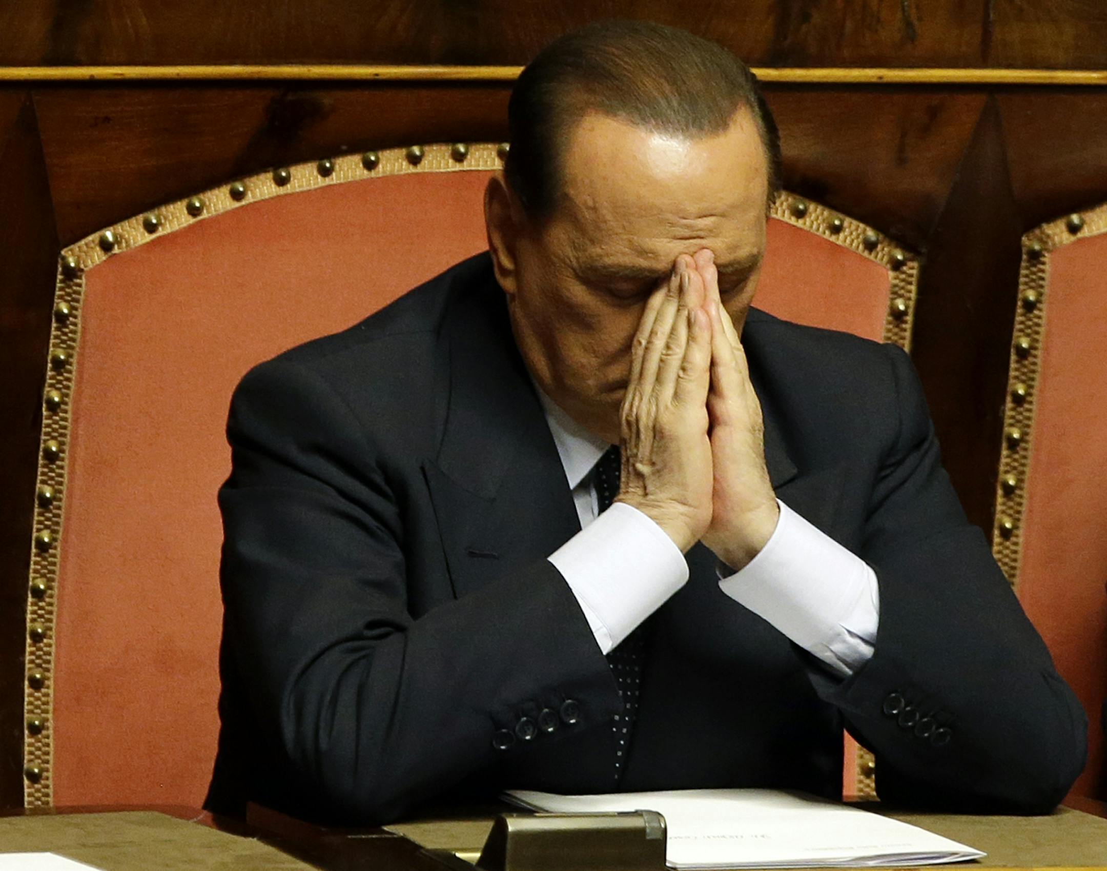 Former Italian Premier Silvio Berlusconi attends a Senate session in Rome where his top aide, Interior Minister Angelino Alfano, faces a vote of non-confidence, Friday, July 19, 2013. A judge in Naples will evaluate Friday the possible indictment of Berlusconi on charges of corruption for allegedly having paid a rival lawmaker to join his party. Meanwhile a court in Milan is expected later today to reach a verdict in a trial which sees three former Berlusconi aides, Nicole Minetti, Lele Mora and