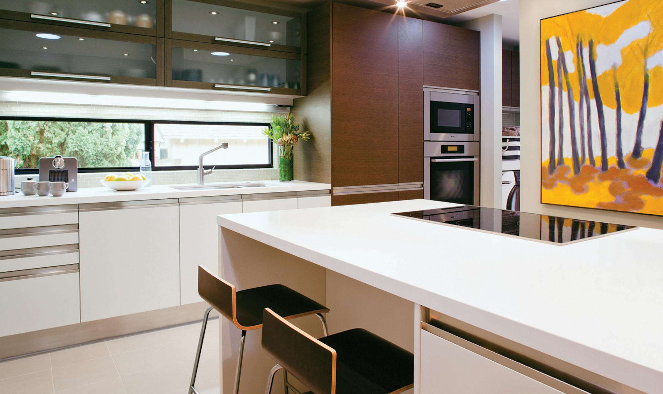 Integrated handles and long, brushed-nickel pulls are new trends in cabinet hardware, giving kitchens a sleek, contemporary look.