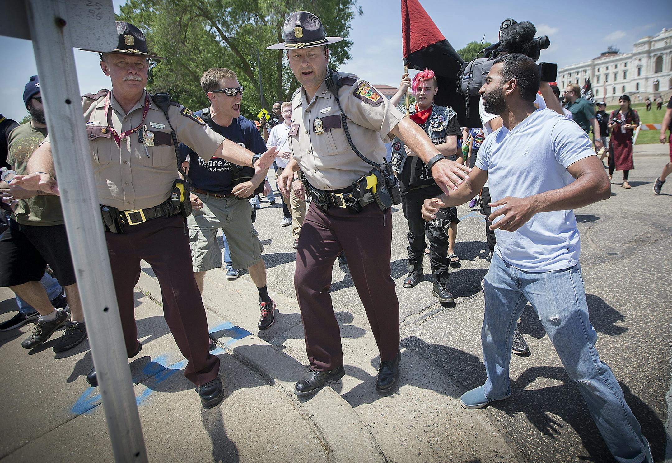 An anti-Sharia law group and antifascist protesters clashed during dueling rallies at the Minnesota State Capitol, Saturday, June 10, 2017 in St. Paul, MN. When a small faction of the anti-sharia group challenged the protesters outside, the Minnesota State Patrol had to intervene.