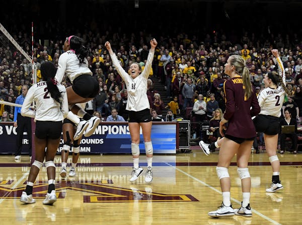 The Gophers celebrated their 3-0 sweep over Bryant University Friday night.