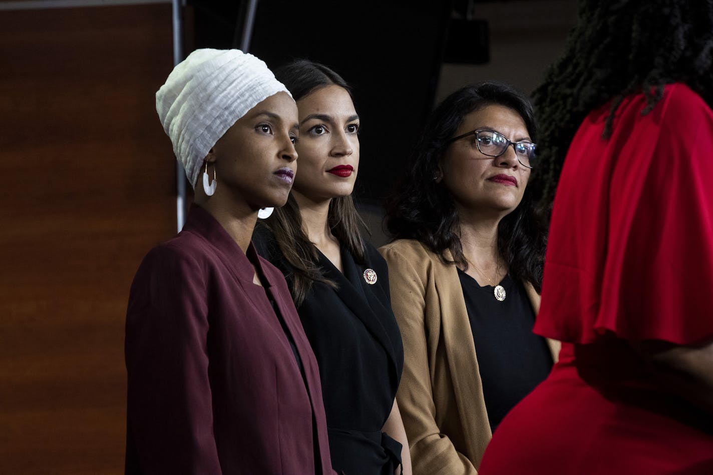 FILE -- From left: Reps. Ilhan Omar (D-Minn.), Alexandria Ocasio-Cortez (D-N.Y.) and Rashida Tlaib (D-Mich.) listen as Ayanna Pressley (D-Mass.) speaks at a news conference on Capitol Hill in Washington, July 15, 2019. President Donald Trump called on Thursday, August 15, for Israel to bar the entry of Omar and Tlaib, who had planned to visit the West Bank, in an extraordinary step to influence an allied nation and punish his political opponents at home. (Anna Moneymaker/The New York Times)