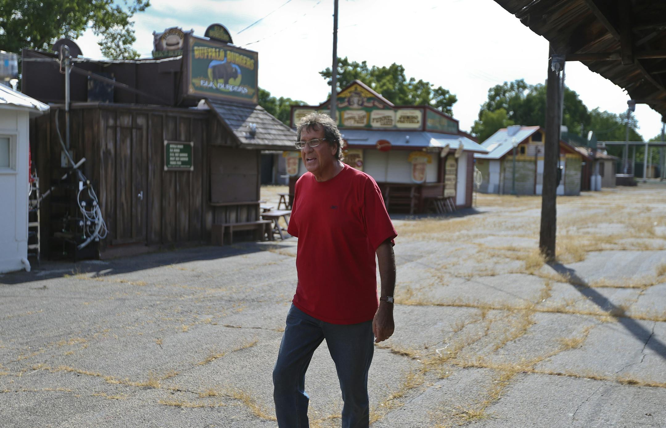 Long time Heritage Square vendor Jerry Woldorski walked through an area of the square in at the Minnesota State Fairgrounds on August 1, 2013 in Falcon Heights, Minn. Woldorski has a buffalo burger stand. He knows about the changes being made to Heritage Square but is unsure how that will effect his future at the fair. ] (RENEE JONES SCHNEIDER &#x2022; reneejones@startribune.com) jerry woldorski 612 669 5560
