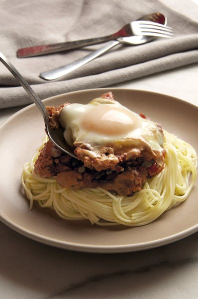 Credit: Donna Turner Ruhlman, from EGG Copyright 2014 by Michael Ruhlman Eggs in Puttanesca Sauce with Angel Hair Pasta