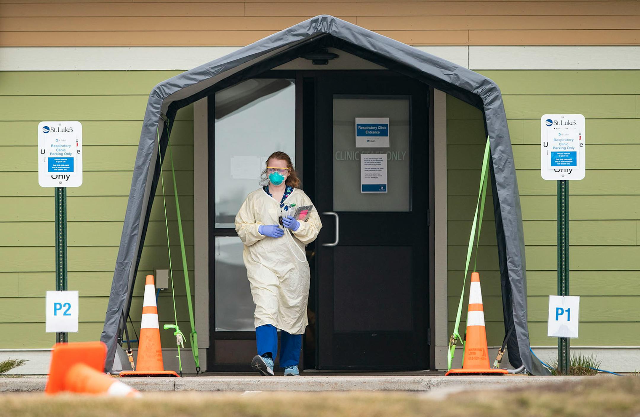 Medical Assistant Courtney Banks stepped out of St. Luke's Miller Creek Medical Clinic in Duluth, MN on Monday to take the temperature of a patient at their drive up COVID-19 testing site.