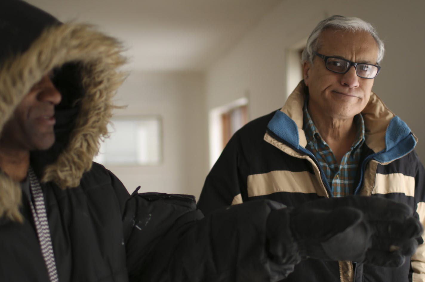 Mahmoud Khan with a member of his maintenance crew, Melvin Snoddy, left, in one of his former rental properties in north Minneapolis Monday afternoon. ] JEFF WHEELER &#x2022; jeff.wheeler@startribune.com Landlord Mahmoud Khan, who owns dozens of properties on the North Side, may finally lose his licenses after years of sparring with the city. Mahmoud Khan showed a couple of his properties Monday afternoon, February 16, 2015 that he says illustrate the dispute he is having with the city of Minnea