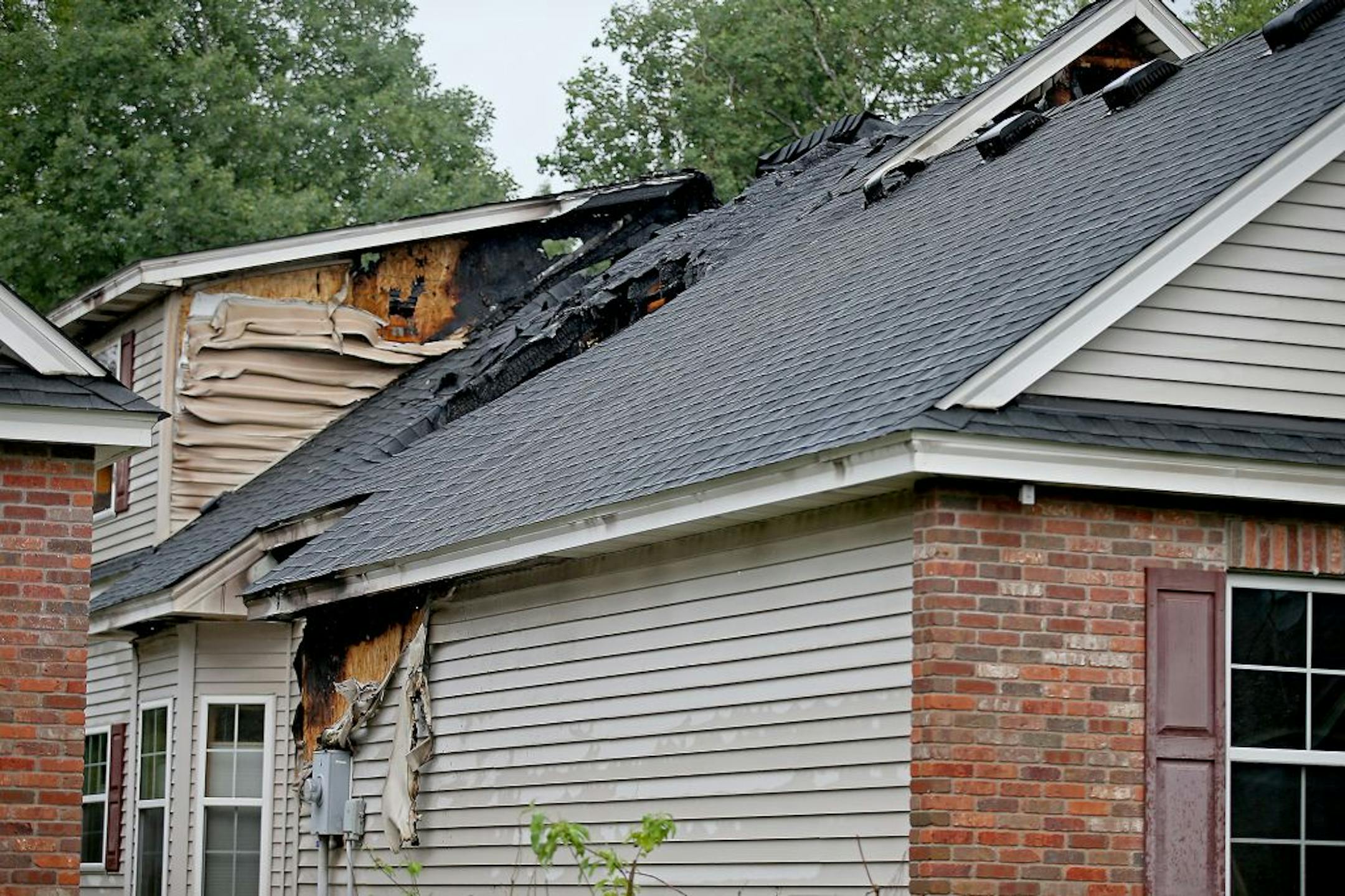 What is left of a home at 10540 Mississippi Circle after a lightning strike, Monday, July 6, 2015 in Brooklyn Park, MN.
