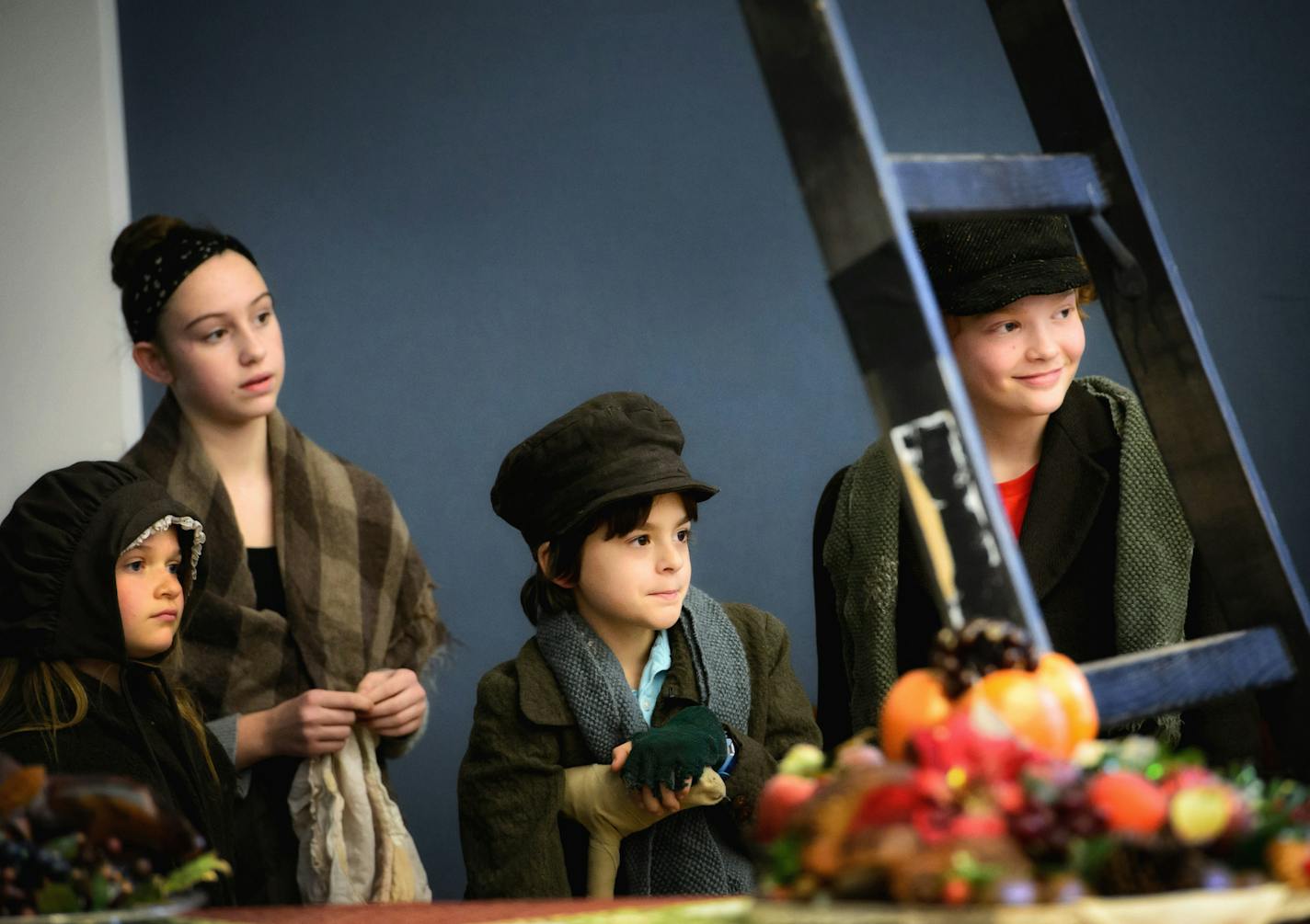 The Cratchit kids (Caitlyn Carroll, Delaney Hunter, Otto Dregni and T.J. McCormick) waited offstage for their scene.