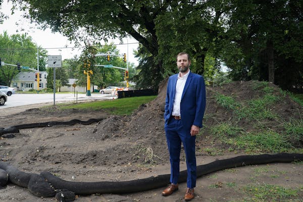 Developer Steve Furlong stood at a site in Bloomington where he hoped to build 15 townhouses, bringing more density and affordable housing to the city