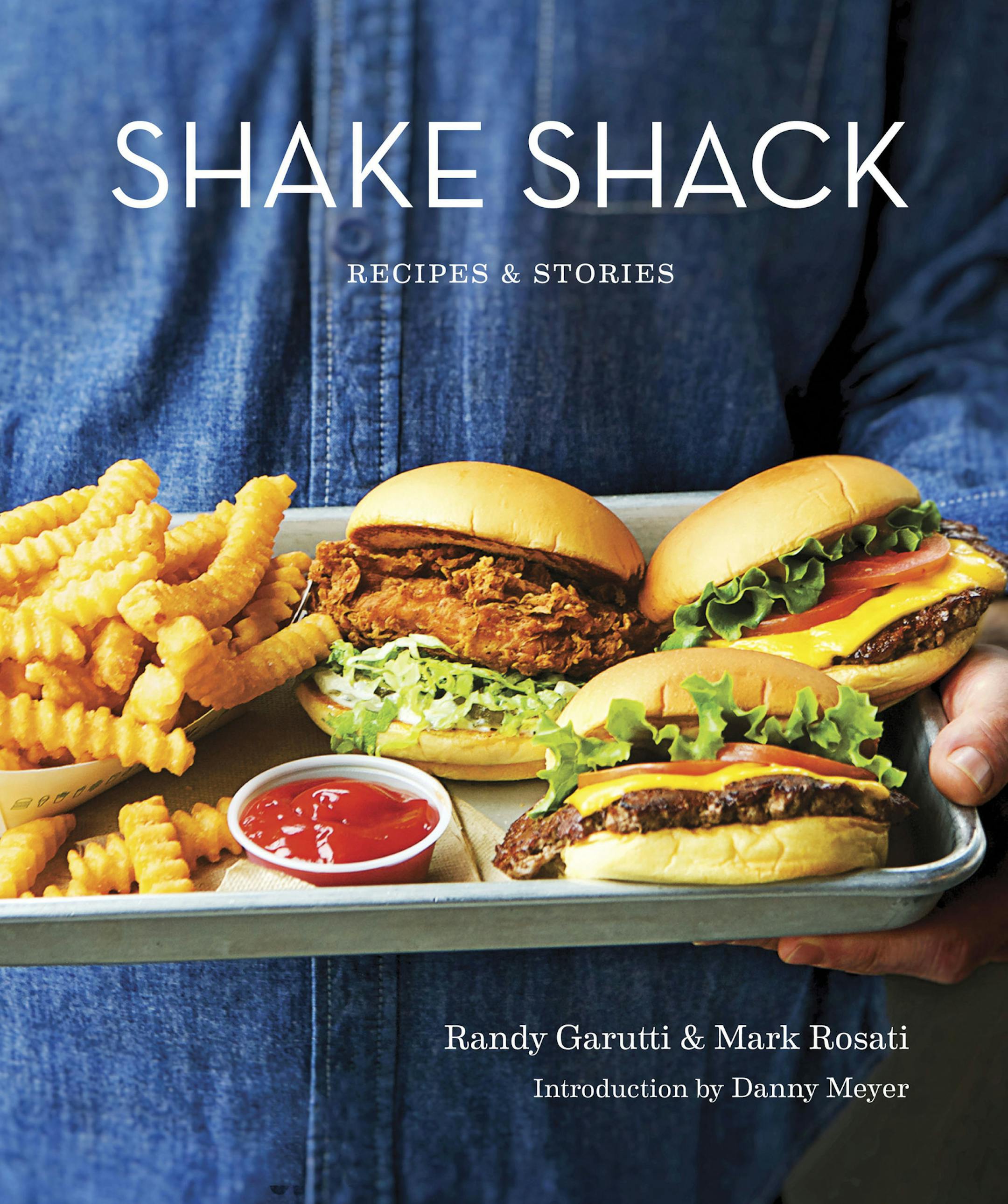 This image provided by Penguin Random House shows the cover of the book "Shake Shack: Recipes & Stories." The book was co-written by Shake Shack's CEO, Randy Garutti, and culinary director Mark Rosati. (Penguin Random House via AP)