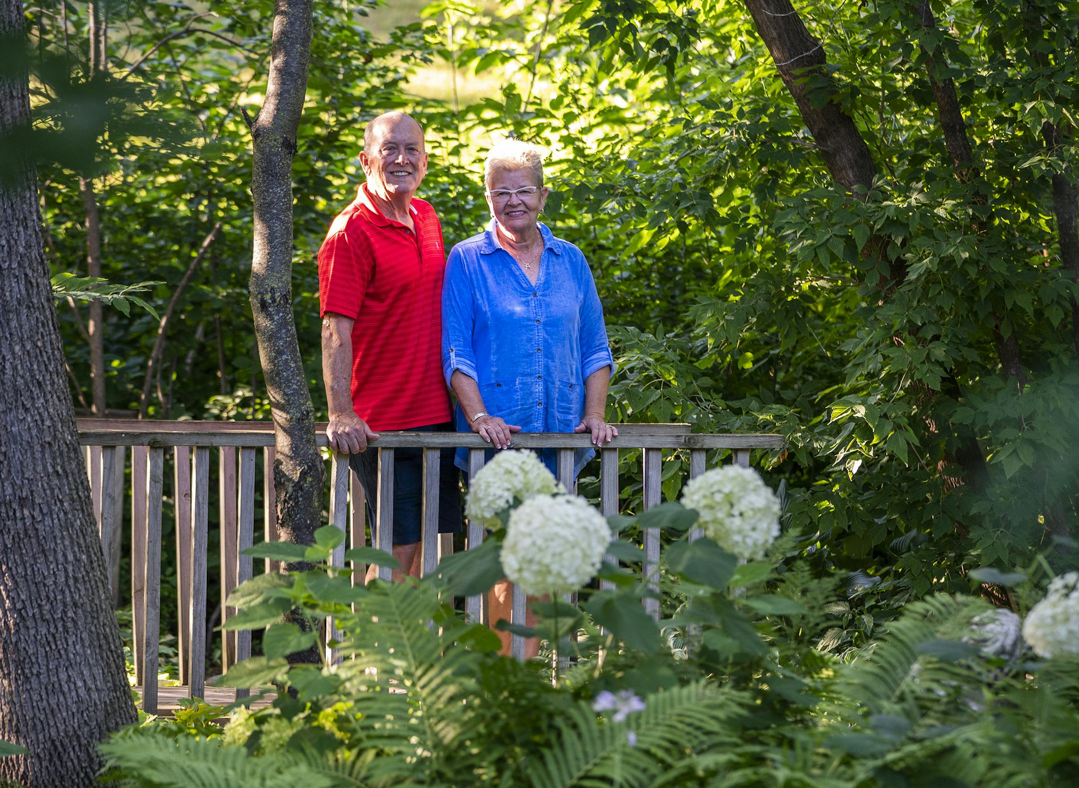 Mike and Vani Phelps stood amid the lush greenery of their Beautiful Gardens winner in Lakeville.