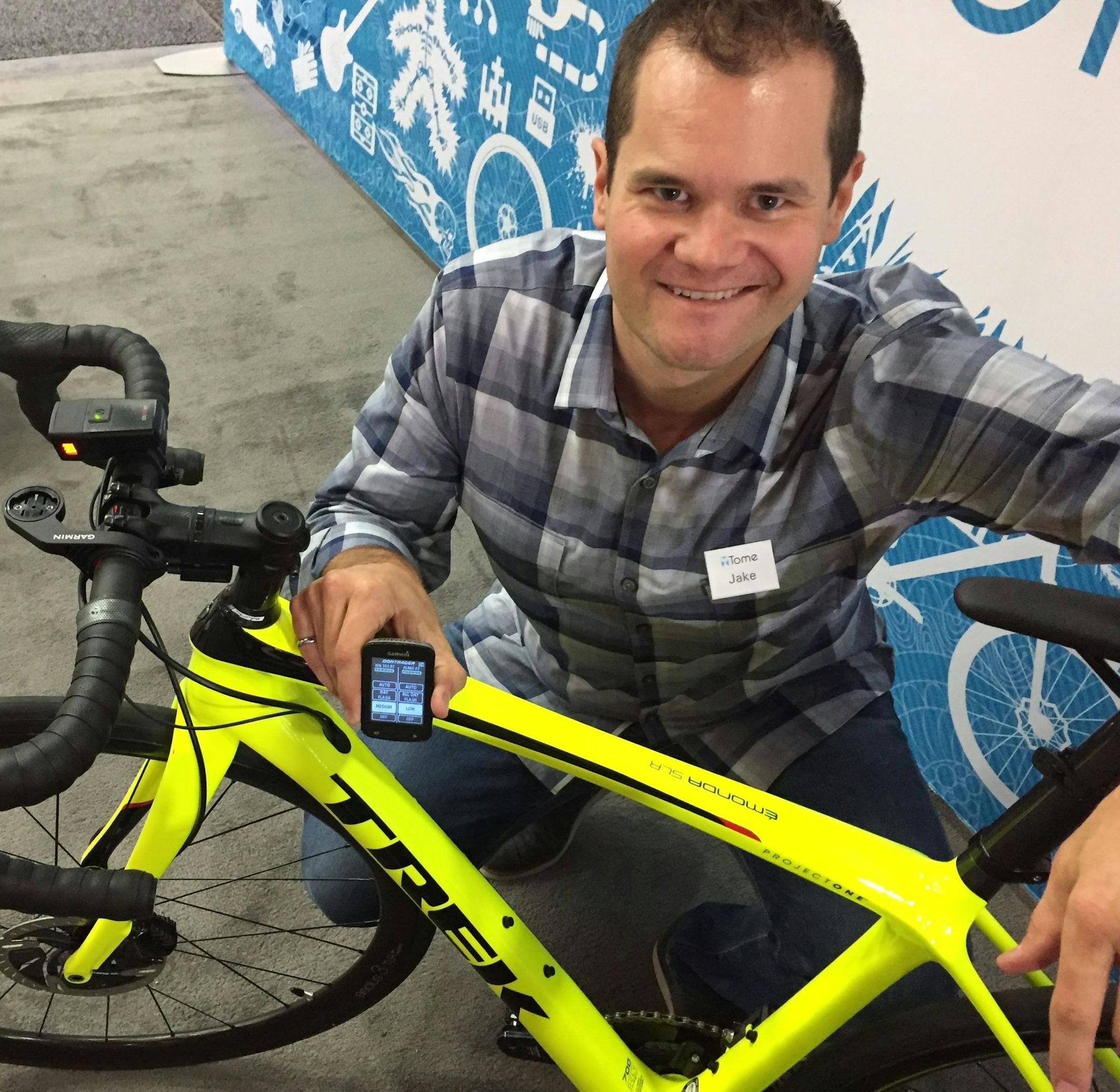Jake Sigal, CEO of Tome software, shows off a piece of cycling equipment that could be made smarter through a research project his company and Trek Bicycle are launching at Mcity in Ann Arbor, Mich. Sigal says smarter bikes and accessories could communicate with cars and trucks and help make cycling safer. (Eric D. Lawrence/Detroit Free Press/TNS) ORG XMIT: 1210937