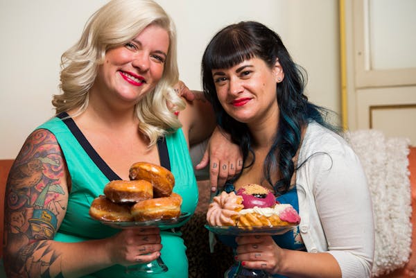 Teresa Fox, left, and Arwyn Birch, co-owners of Glam Doll Donuts, sat for a portrait in their donut shop on Nicollet Avenue. ] Isaac Hale ï isaac.hal