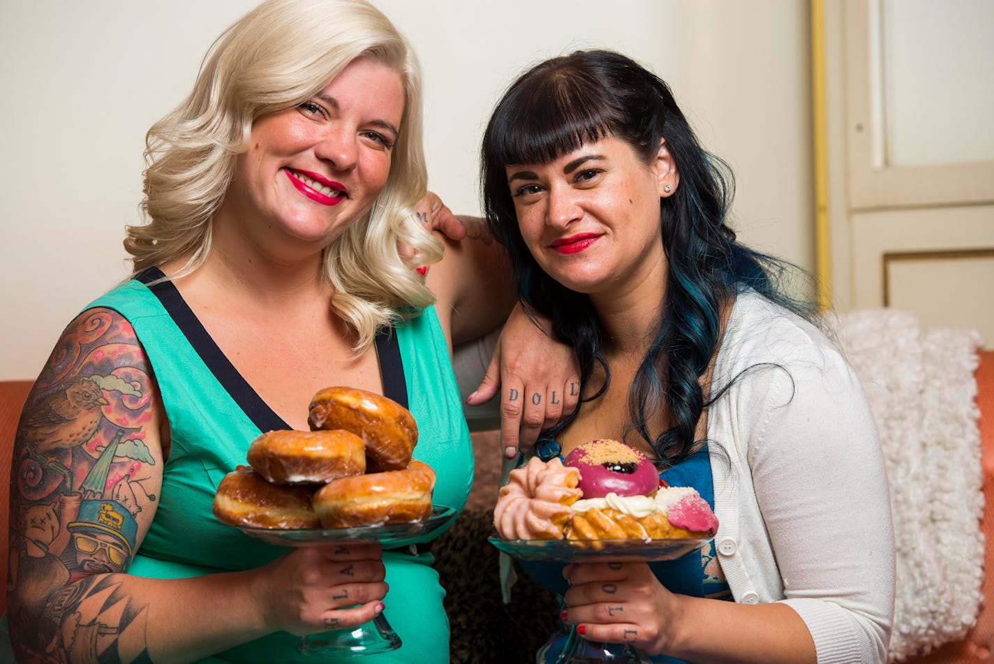 Teresa Fox, left, and Arwyn Birch, co-owners of Glam Doll Donuts, sat for a portrait in their donut shop on Nicollet Avenue. ] Isaac Hale ï isaac.hale@startribune.com This year's Taste Fifty focuses on Nicolette Avenue, also know as "Eat Street" in Minneapolis.