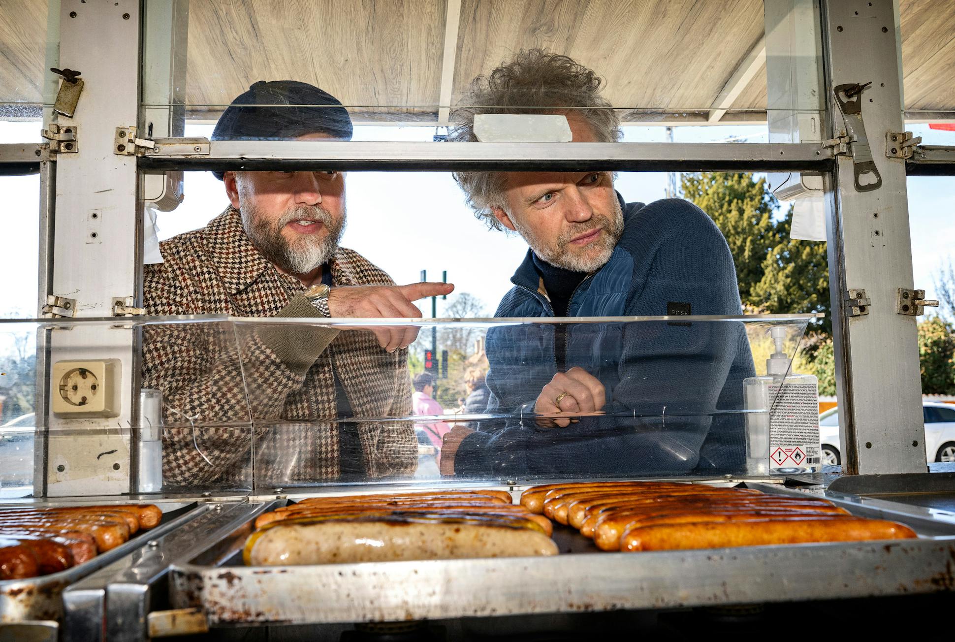 Thomas Søndergård and his husband, Andreas, checked out a sausage stand, a common sight in Copenhagen.