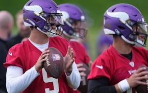 Vikings rookie J.J. McCarthy (9) throws with his fellow quarterbacks during organized team activities last week. At minicamp this week, he might get t