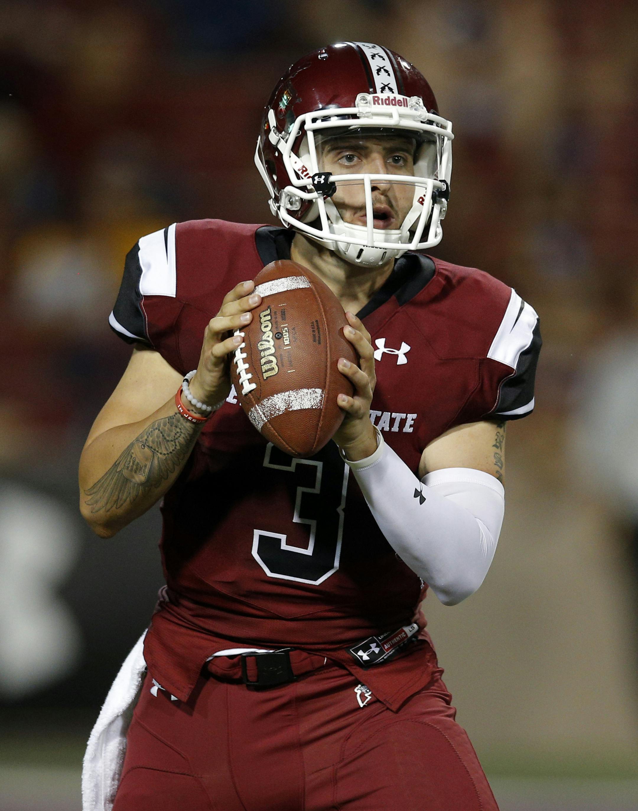 New Mexico State quarterback Matt Romero looks for a receiver during the first half of the team's NCAA college football game against Wyoming in Las Cruces, N.M., Saturday, Aug. 25, 2018. (AP Photo/Andres Leighton)