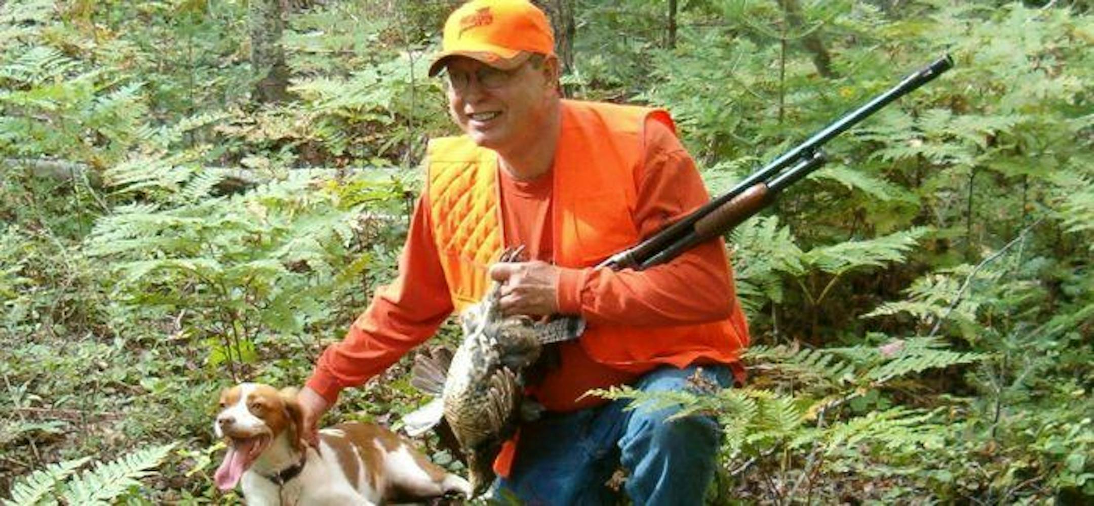 The author's father and Brittany resting after a successful Michigan ruffed grouse hunt.