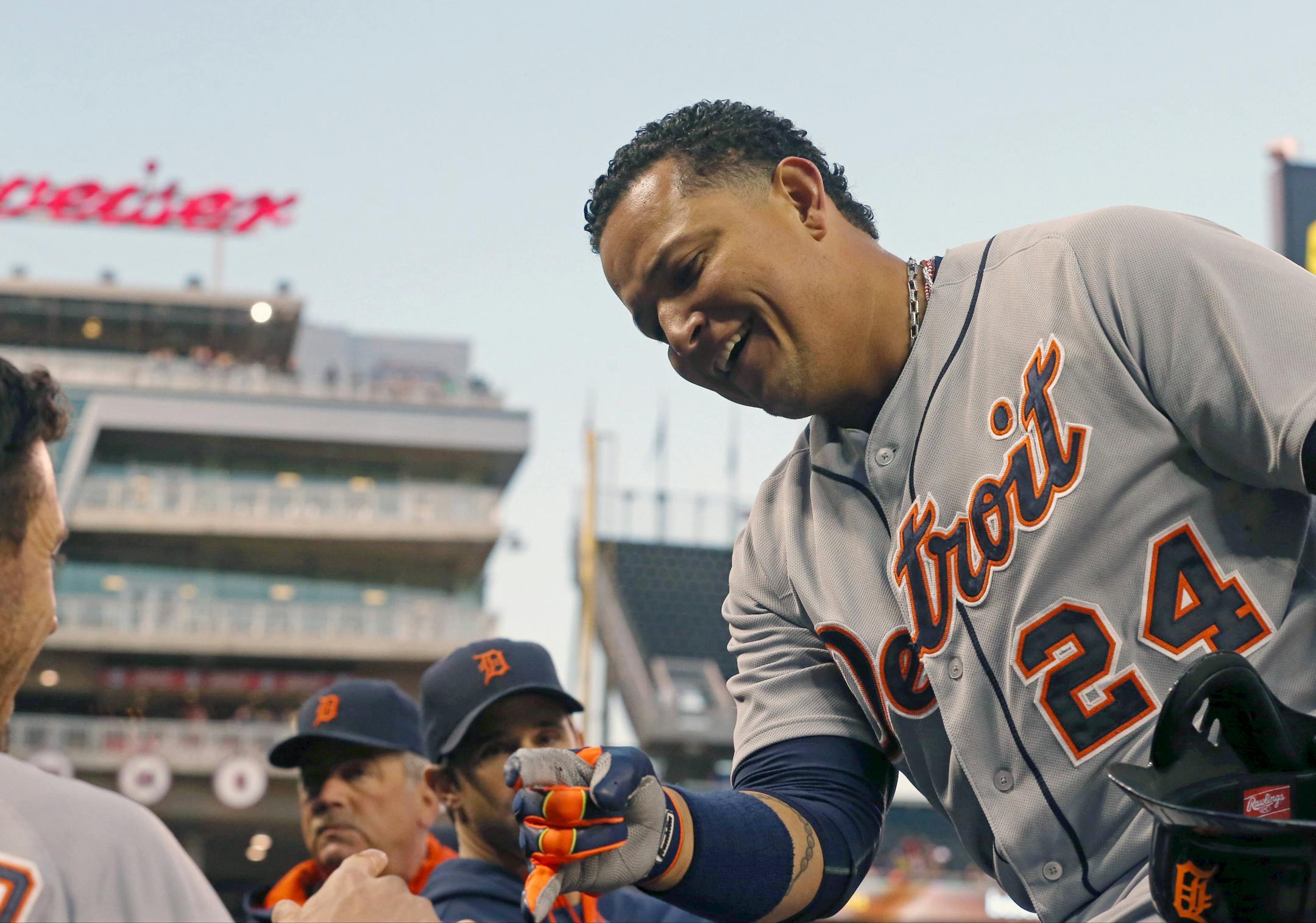 The Tigers' Miguel Cabrera was greeted in the dugout after scoring on a double by Victor Martinez in the first inning Monday.