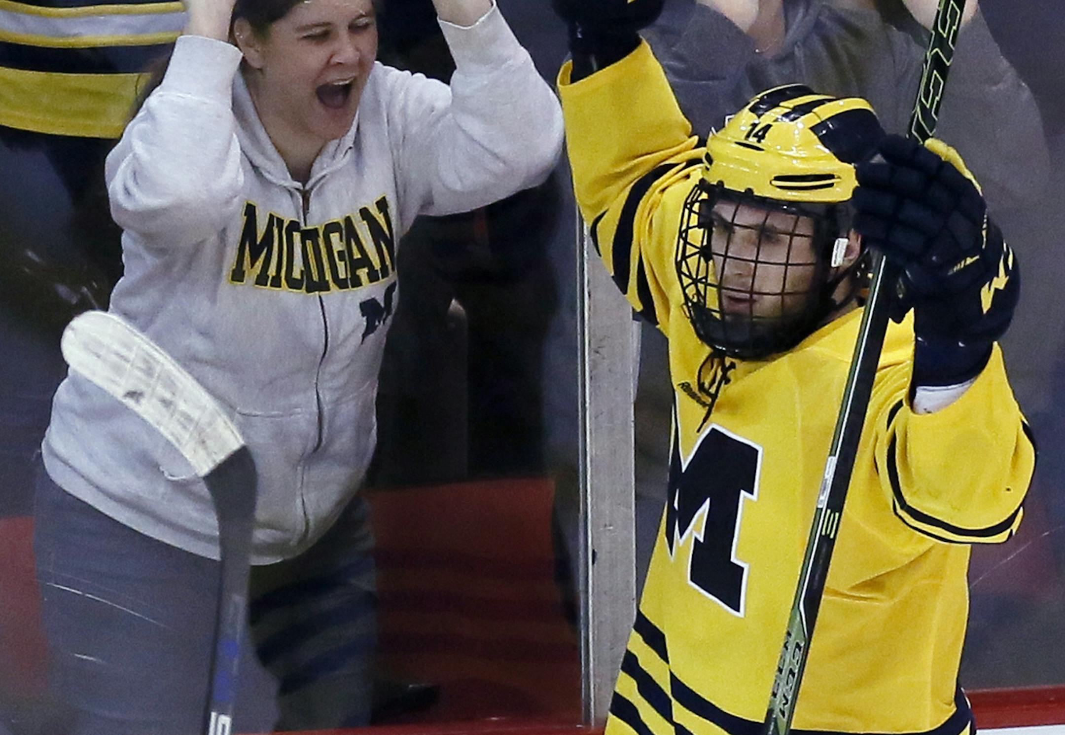 Michigan's Tyler Motte celebrates his goal against Michigan State during the second period of a college hockey game at Joe Louis Arena on Friday, Feb. 5, 2016, in Detroit. (AP Photo/Duane Burleson) ORG XMIT: MIDB106