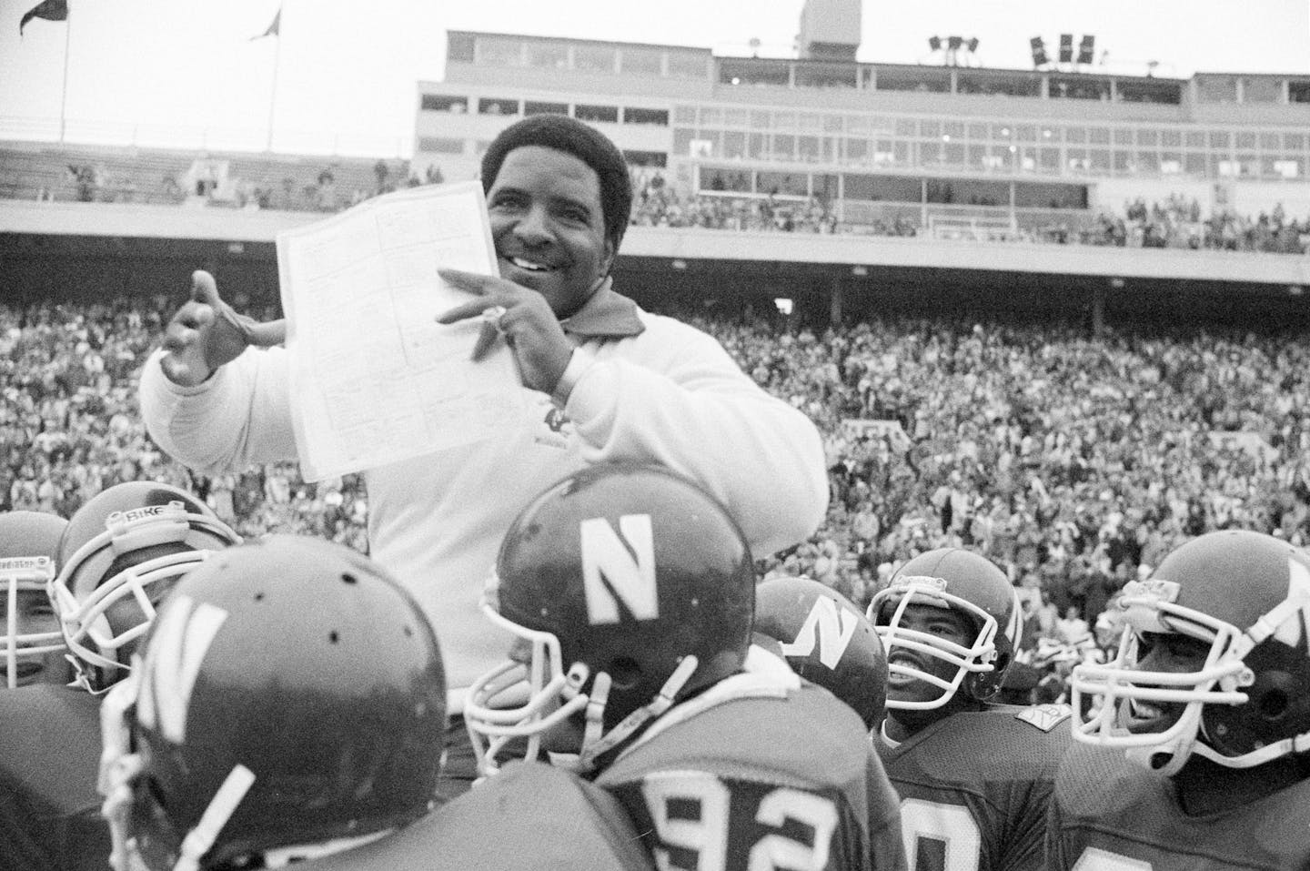 Dennis Green, coach of the Northwestern University Wildcats, is carried from the field by his team after the team defeated the Northern Illinois Huskies, 31-6, breaking a 34-game losing streak, Sept. 25, 1982. It was also Green's first win as head coach of Northwestern. (AP Photo/Charles Knoblock) ORG XMIT: APHS472408