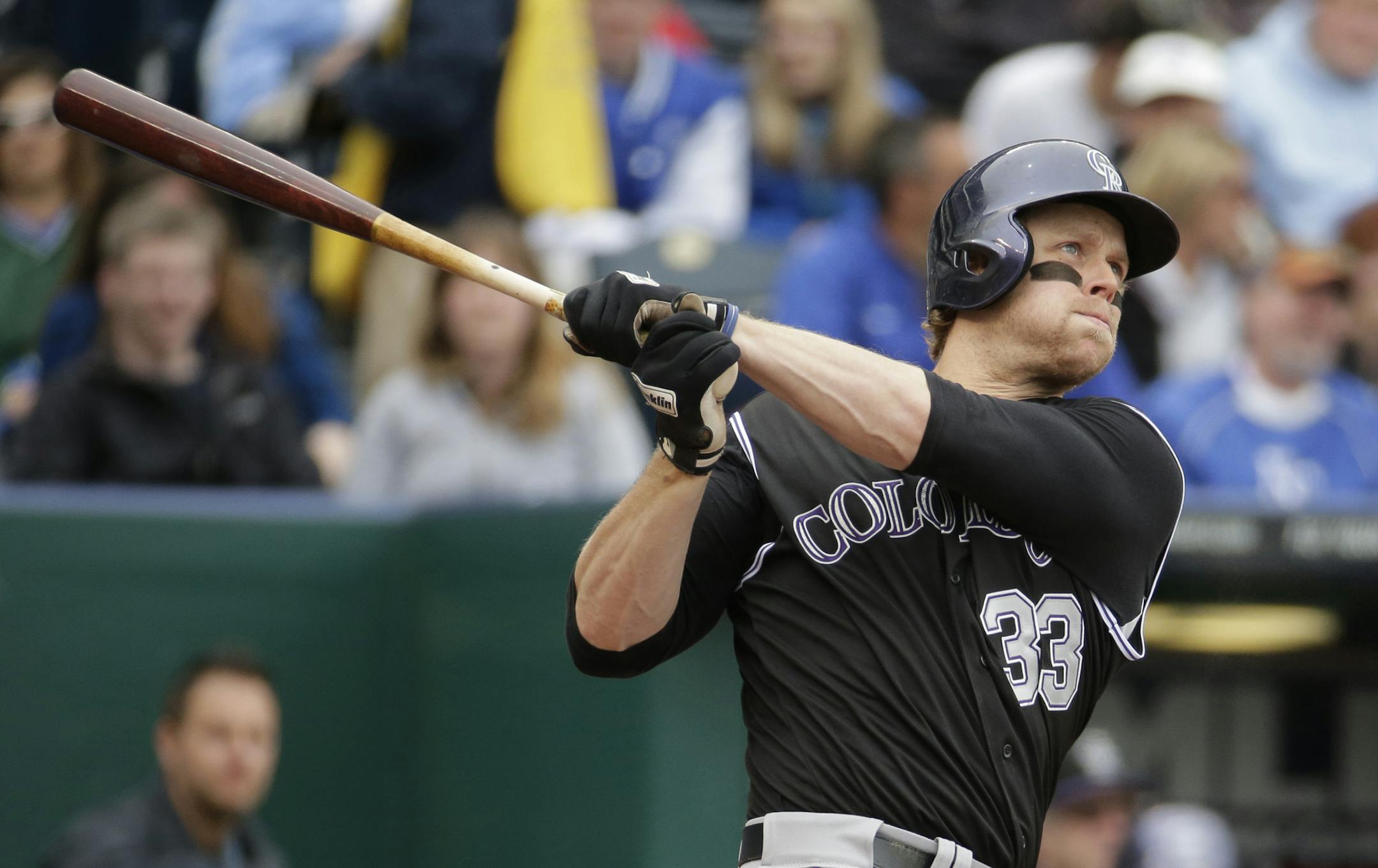 Colorado Rockies' Justin Morneau bats during the second inning of a baseball game against the Kansas City Royals Wednesday, May 14, 2014 in Kansas City, Mo. (AP Photo/Charlie Riedel) ORG XMIT: OTKCR