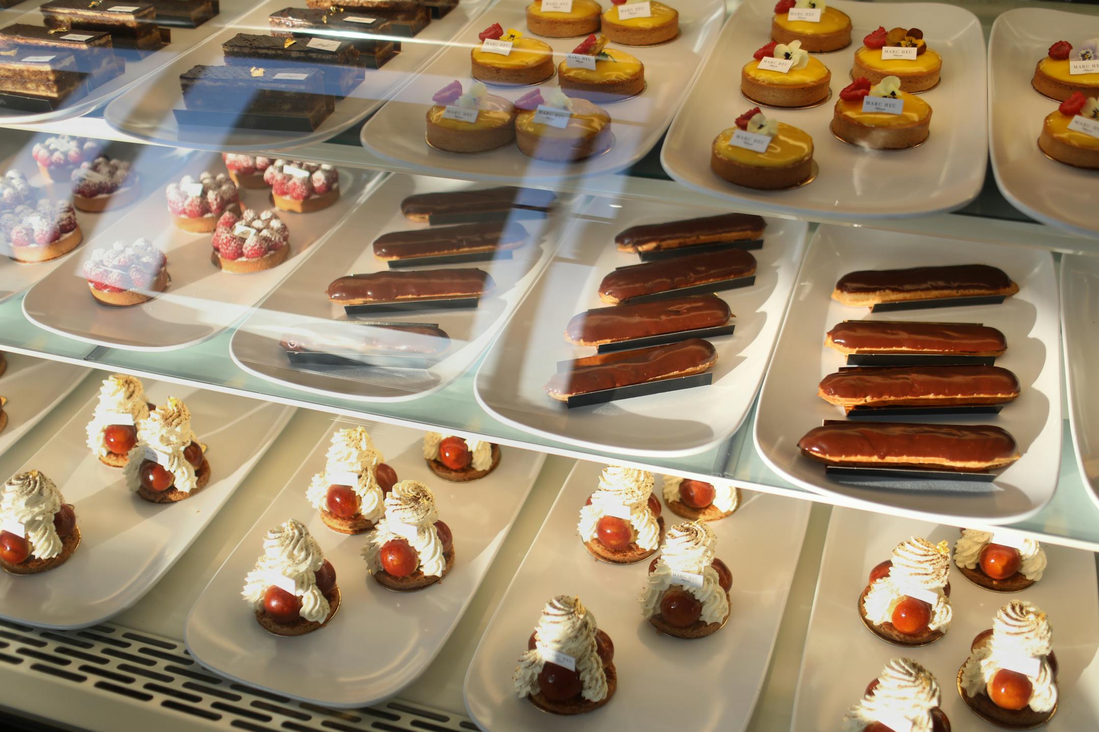 French-born baker Marc Heu opened Heu Patisserie Paris in St. Paul where Heu and his staff use butter from France and chocolate from Belgium to make their works of art--both visual and tasting- and a case with tarts, pastries and cakes are seen Thursday, Jan. 20, 2020, in St. Paul, MN.] DAVID JOLES • david.joles@startribune.com Profile of baker Marc Heu, owner of a classic French bakery (with beautiful pastries to match) on University Avenue in St. Paul's Frogtown.