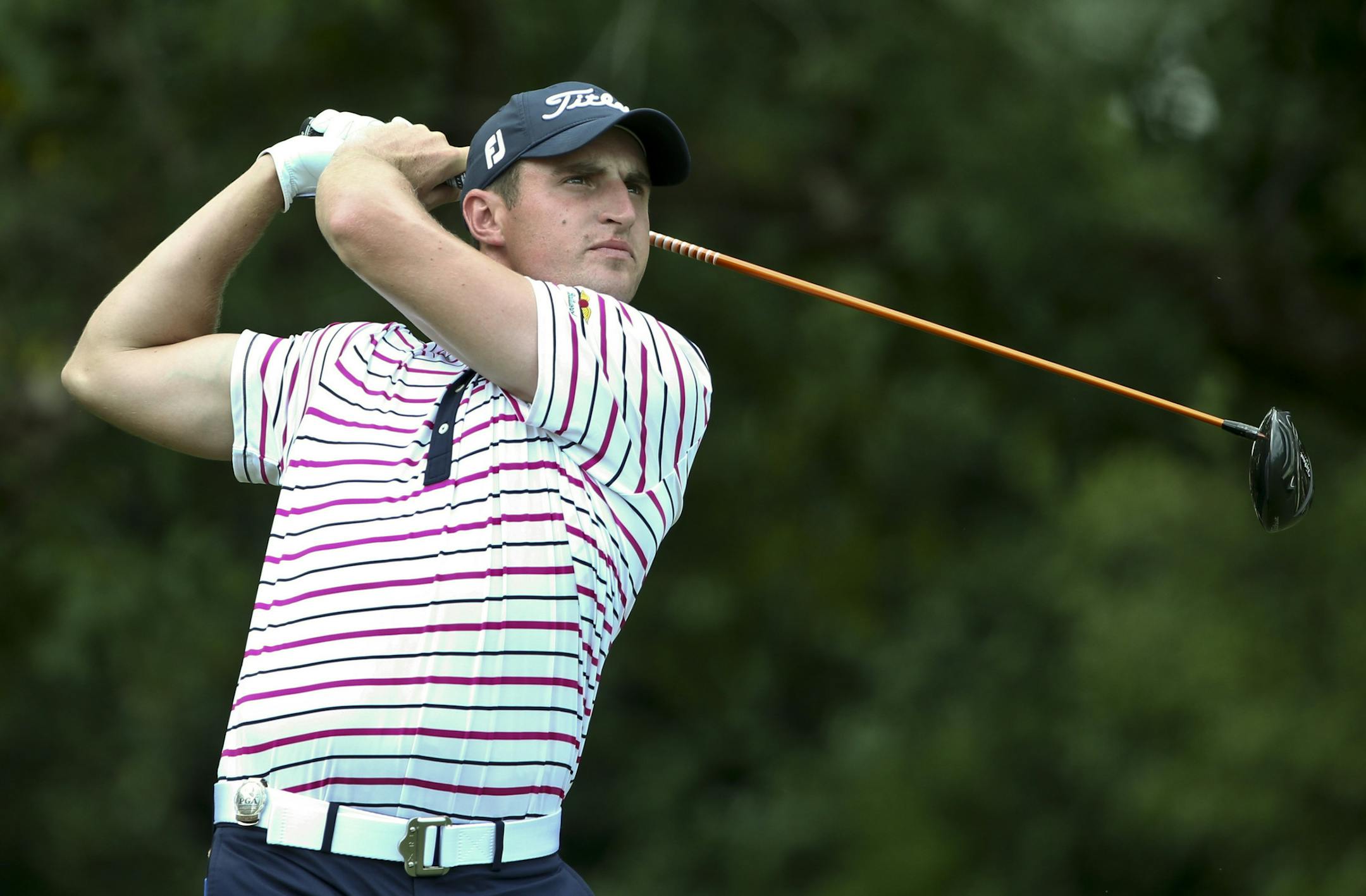 Alex Beach watches his tee shot on the fifth hole during a practice round at the PGA Championship golf tournament at the Quail Hollow Club on Wednesday, Aug. 9, 2017, in Charlotte, N.C. (AP Photo/John Bazemore) ORG XMIT: PGA134