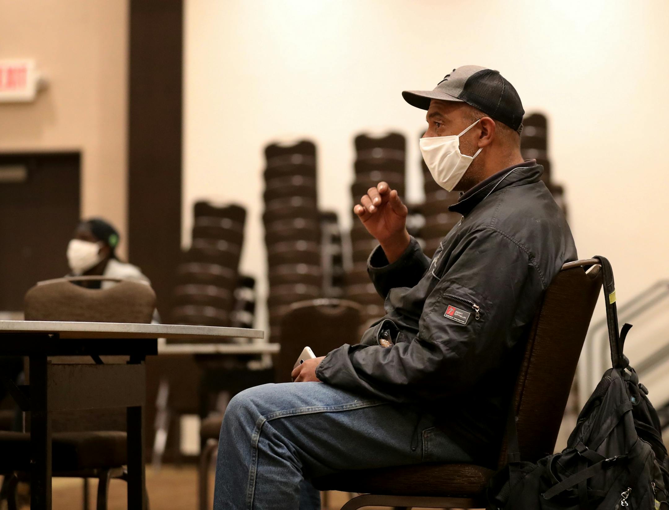 After moving out of the Higher Ground homeless shelter in Minneapolis Douglas Pyle, 49, waits to get checked into his hotel room for the first time Friday, May 1, 2020, in Minneapolis, MN. Pyle is among more than 400 homeless people in Hennepin County who have been relocated to area hotels since the pandemic began. Pyle grew up in Indiana, spent a number of years in Florida and Madison, WI, before coming to Minneapolis 13 years ago and becoming homeless two years ago. Pyle said he hasn't slept i