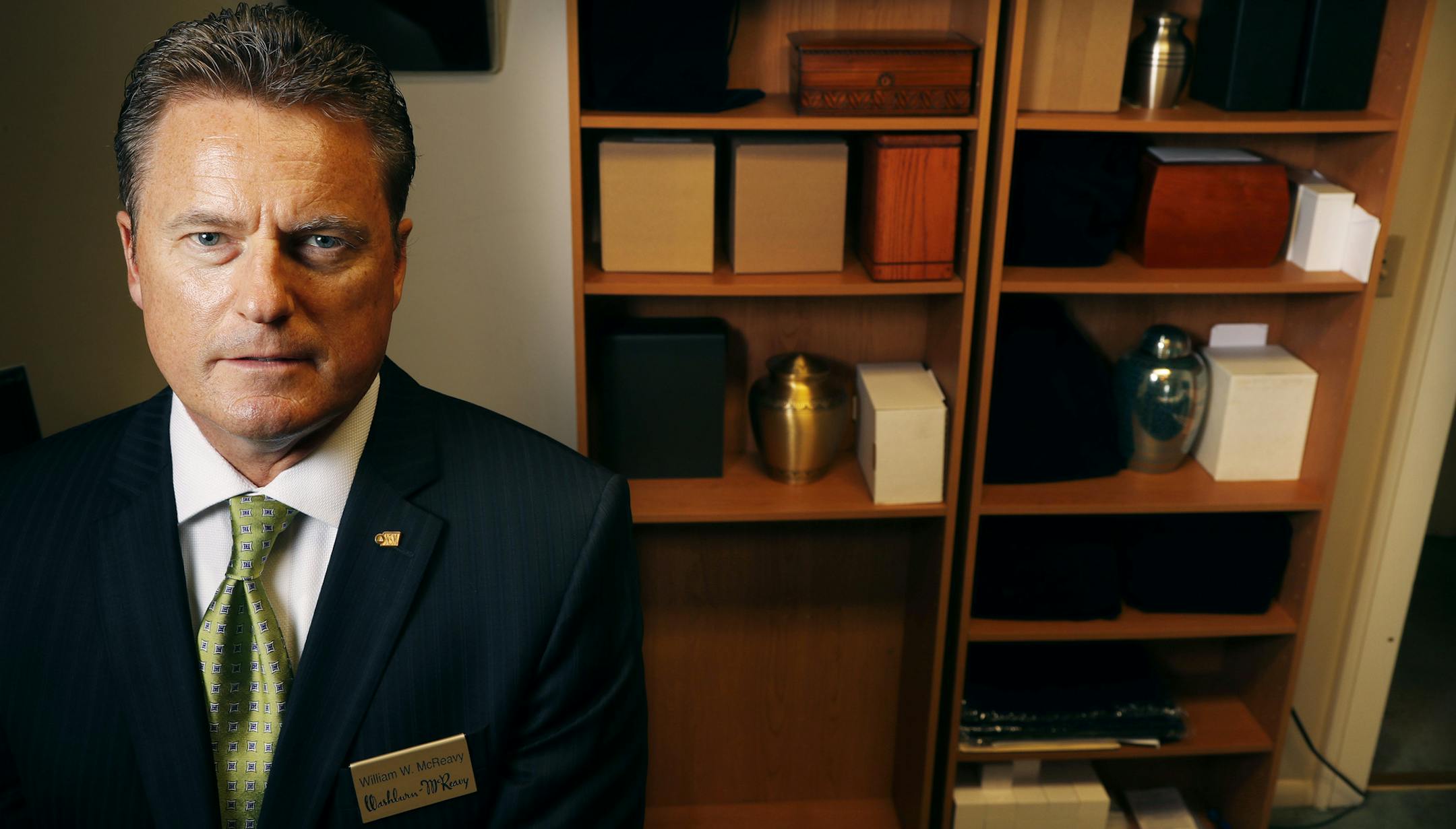 Portrait of Billy McReavy Jr. standing in front of urns containing cremated remains at the Davies Chapel of Washburn-McReavy Thursday September 8, 2016 in Minneapolis, MN. ] More than 60 percent of Minnesotans now choose cremation when they die, providing a cheaper and more convenient alternative to burial for many families. But the trend exposes a problem well-known to funeral directors: some cremated remains are never claimed or picked up after months or years, forcing funeral homes to keep th