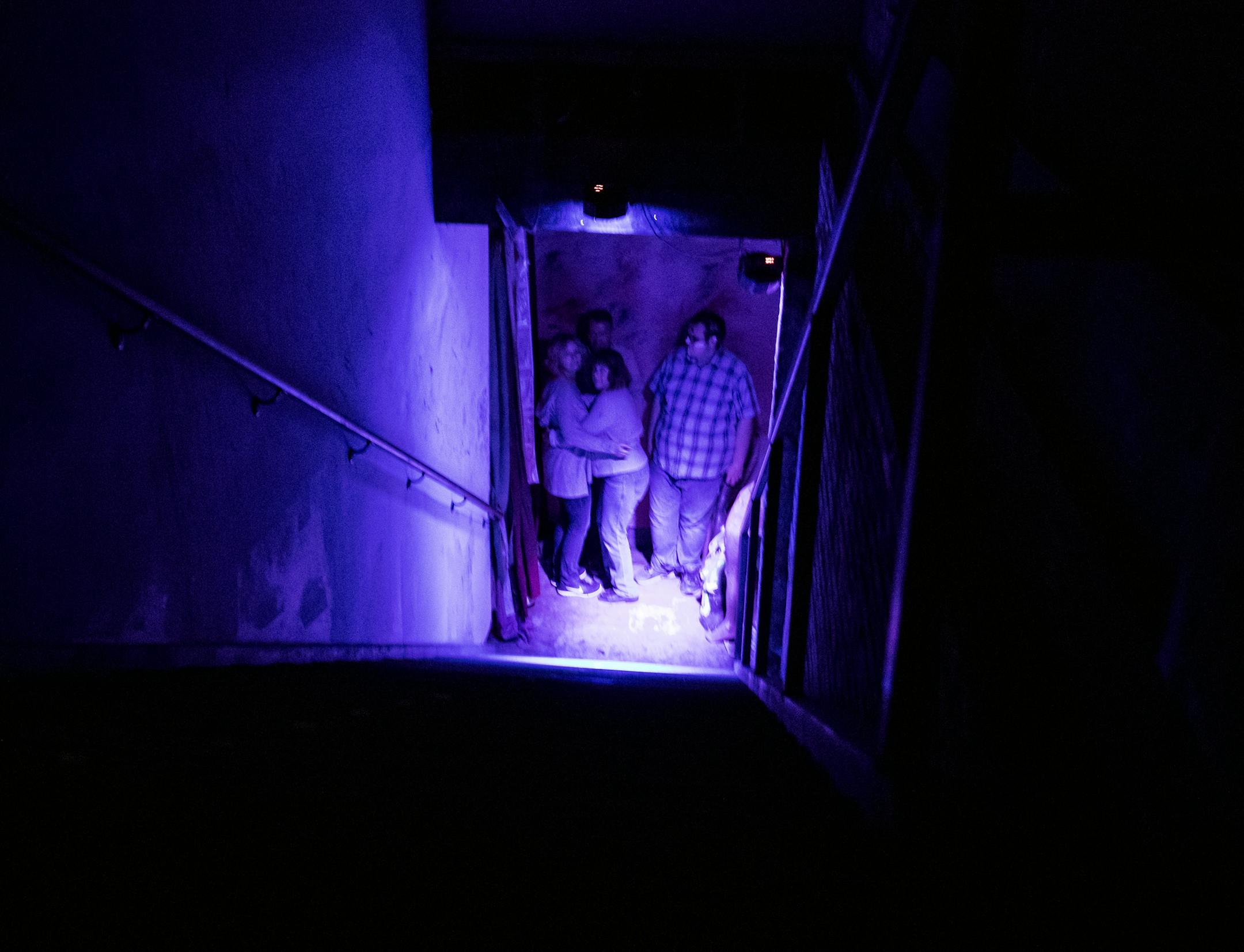 Two women clung to each other at the Haunted Basement at the Soap Factory.