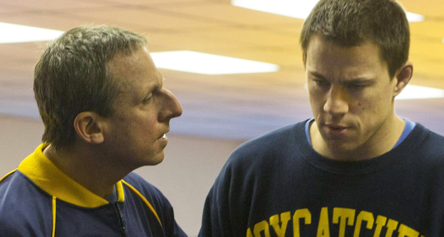 This image released by Sony Pictures Classics shows Steve Carell, left, and Channing Tatum in a scene from "Foxcatcher." The film, based on Olympic wrestler Mark Schultz, will be released on Nov. 14, 2014. (AP Photo/Sony Pictures Classics, Scott Garfield)