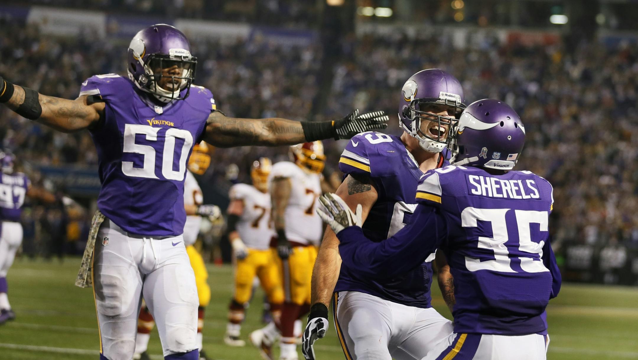 Erin Henderson (50), Jared Allen (69) and Minnesota Vikings cornerback Marcus Sherels (35) celebrated Sherels defense in the fourth quarter during NFL action between the Minnesota Vikings and the Washington Redskins at Mall of America Field Thursday November 7, 2013 in Minneapolis, MN.