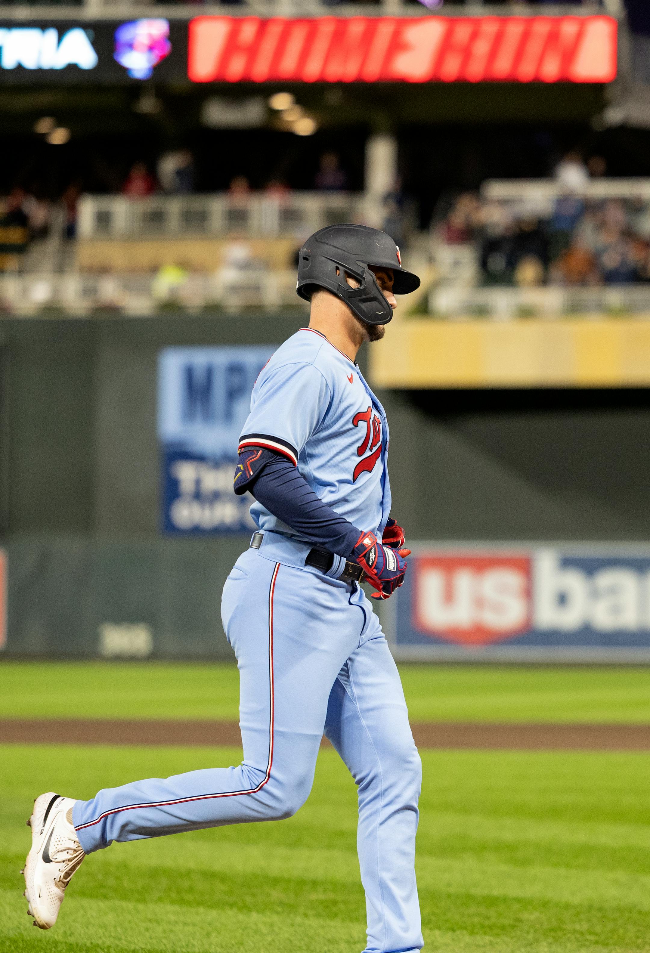 Matt Wallner of the Minnesota Twins approaches the plate after hitting a home run in the sixth inning.