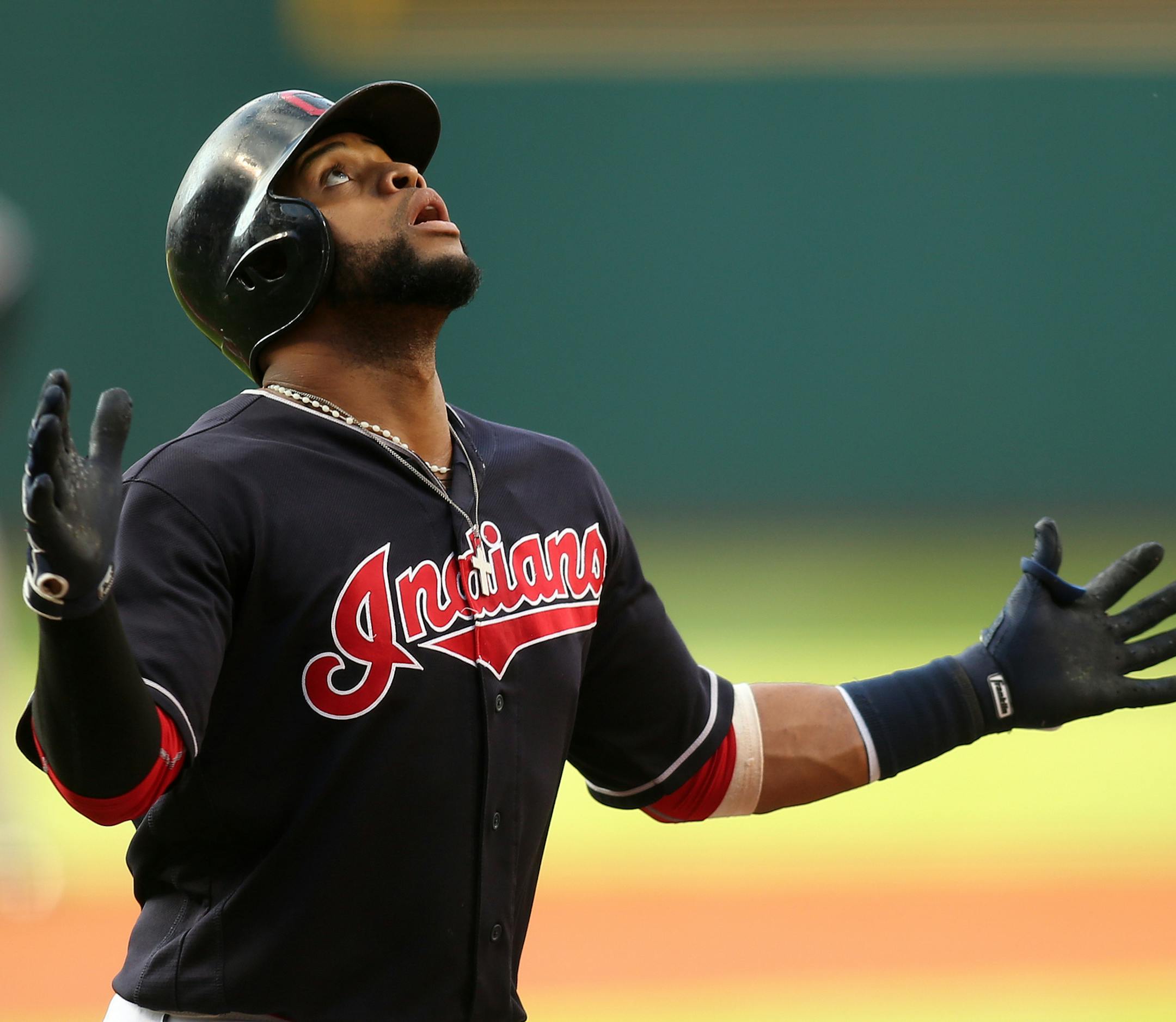 Cleveland Indians' Carlos Santana looks up as he crosses home plate after hitting a leadoff home run in the first inning of a baseball game against the New York Yankees, Friday, July 8, 2016, in Cleveland. (AP Photo/Aaron Josefczyk)