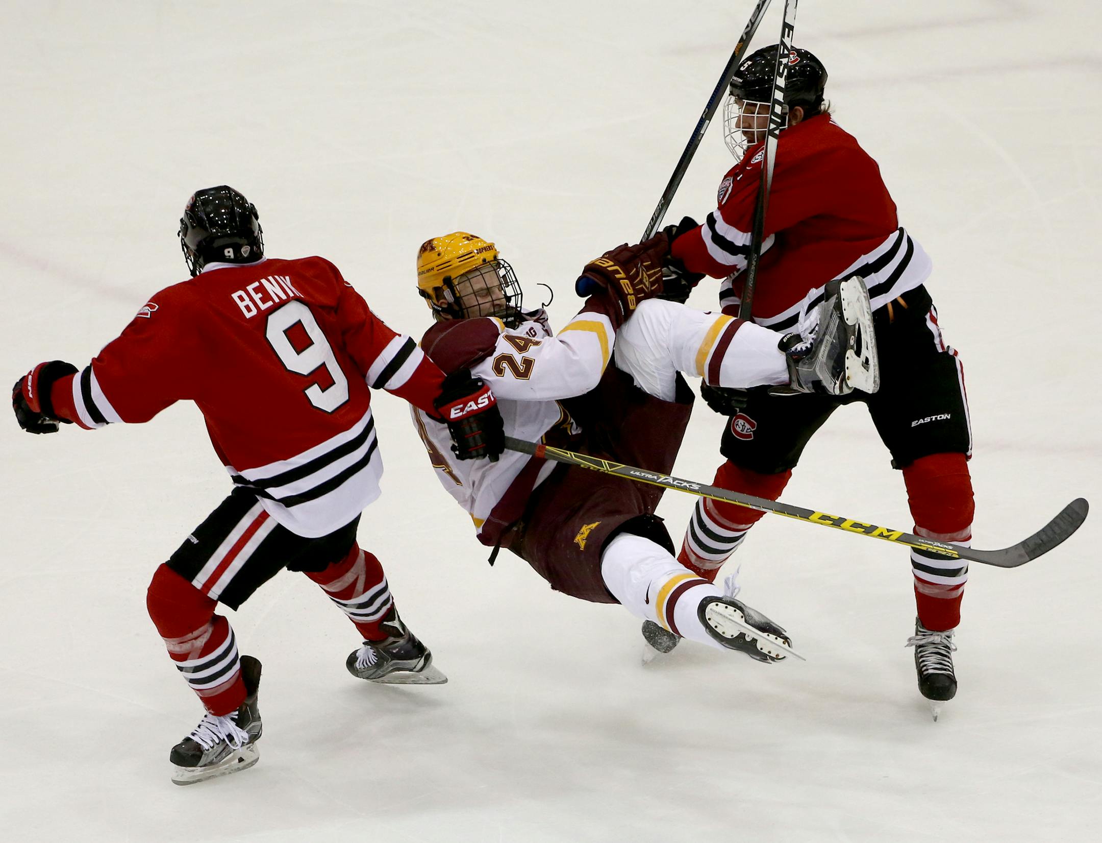 St. Cloud State's Nathan Widman knocked Gopher Hudson Fasching off the puck during the first period ] (KYNDELL HARKNESS/STAR TRIBUNE) kyndell.harkness@startribune.com Gophers vs St Cloud State at Mariucci Area in Minneapolis Min., Friday November 27, 2015.