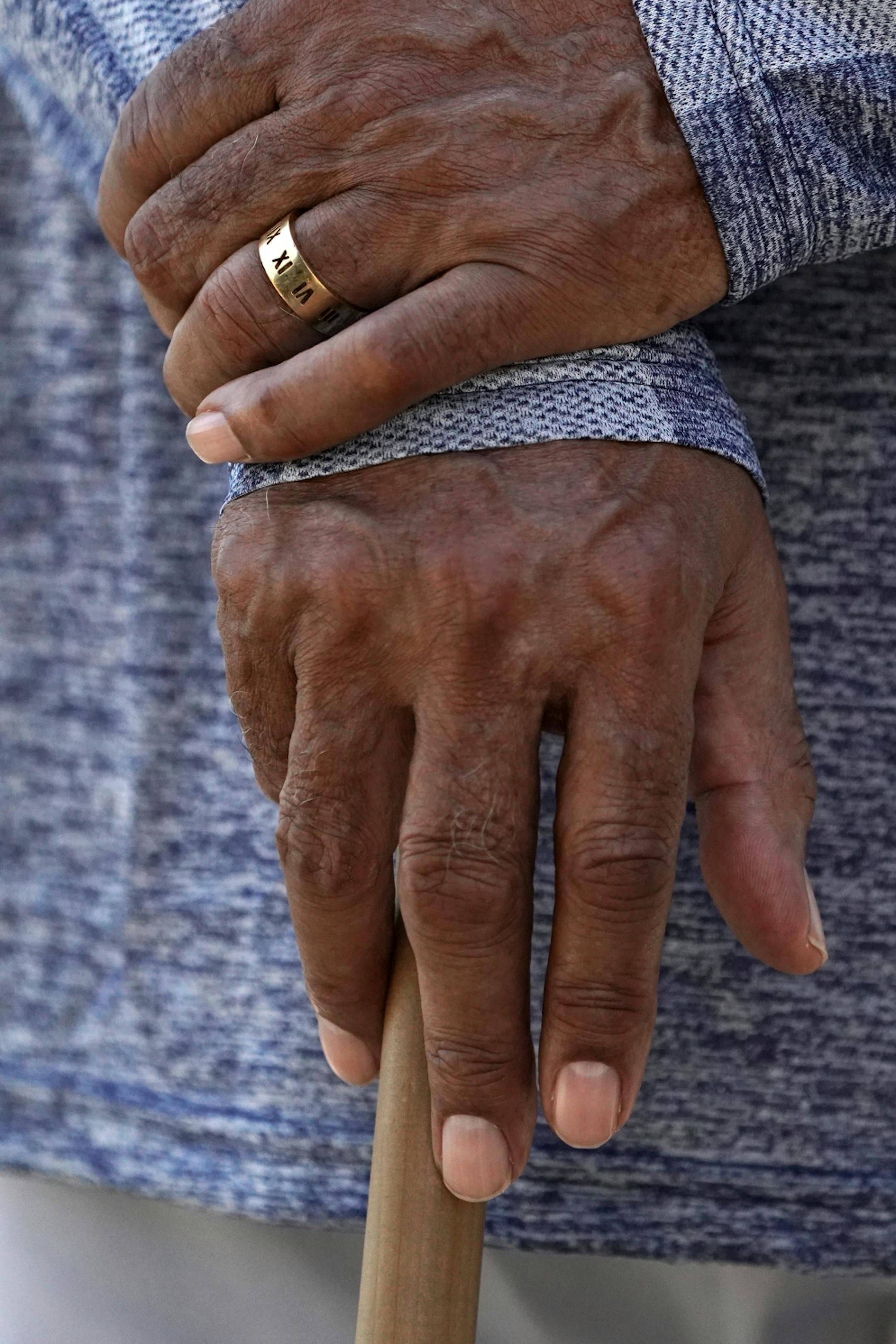 Minnesota Twins hall of famer Rod Carew held onto a bat as he watched the morning workouts with the few field players present at Spring Training Saturday.