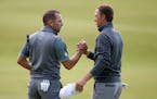 Jordan Spieth, right, and Sergio Garcia shook hands on the 18th green after completing the third round of the British Open on Sunday. Spieth, who is t