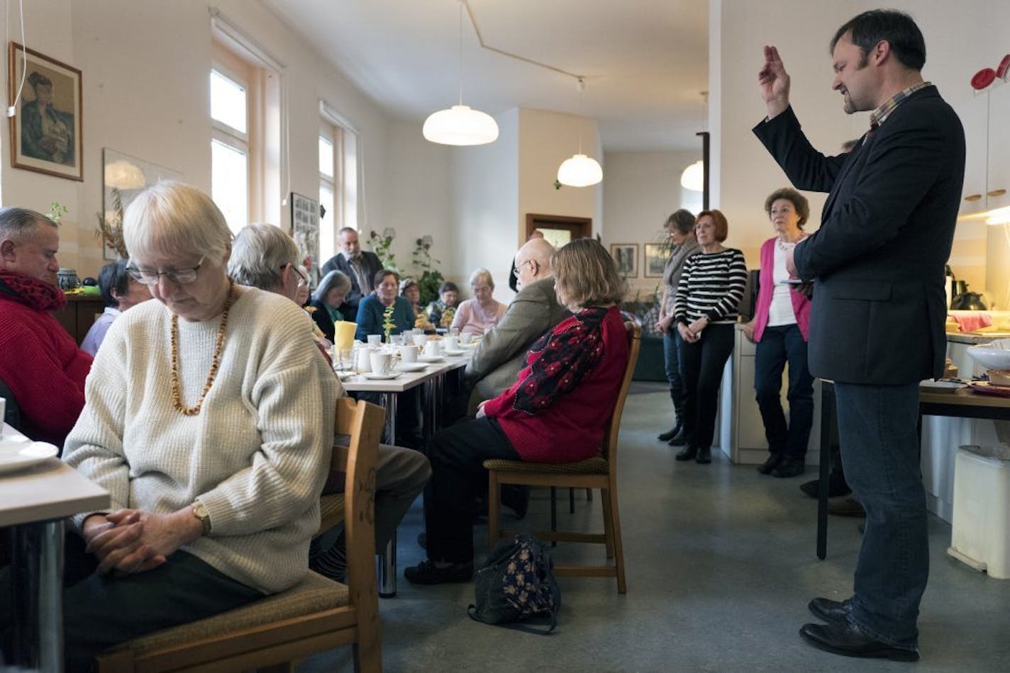 Pastor Helge Voigt prayed with a group of different denominational Christians during a luncheon at a cafe Wednesday November 02, 2016 in Leipzig Germany.