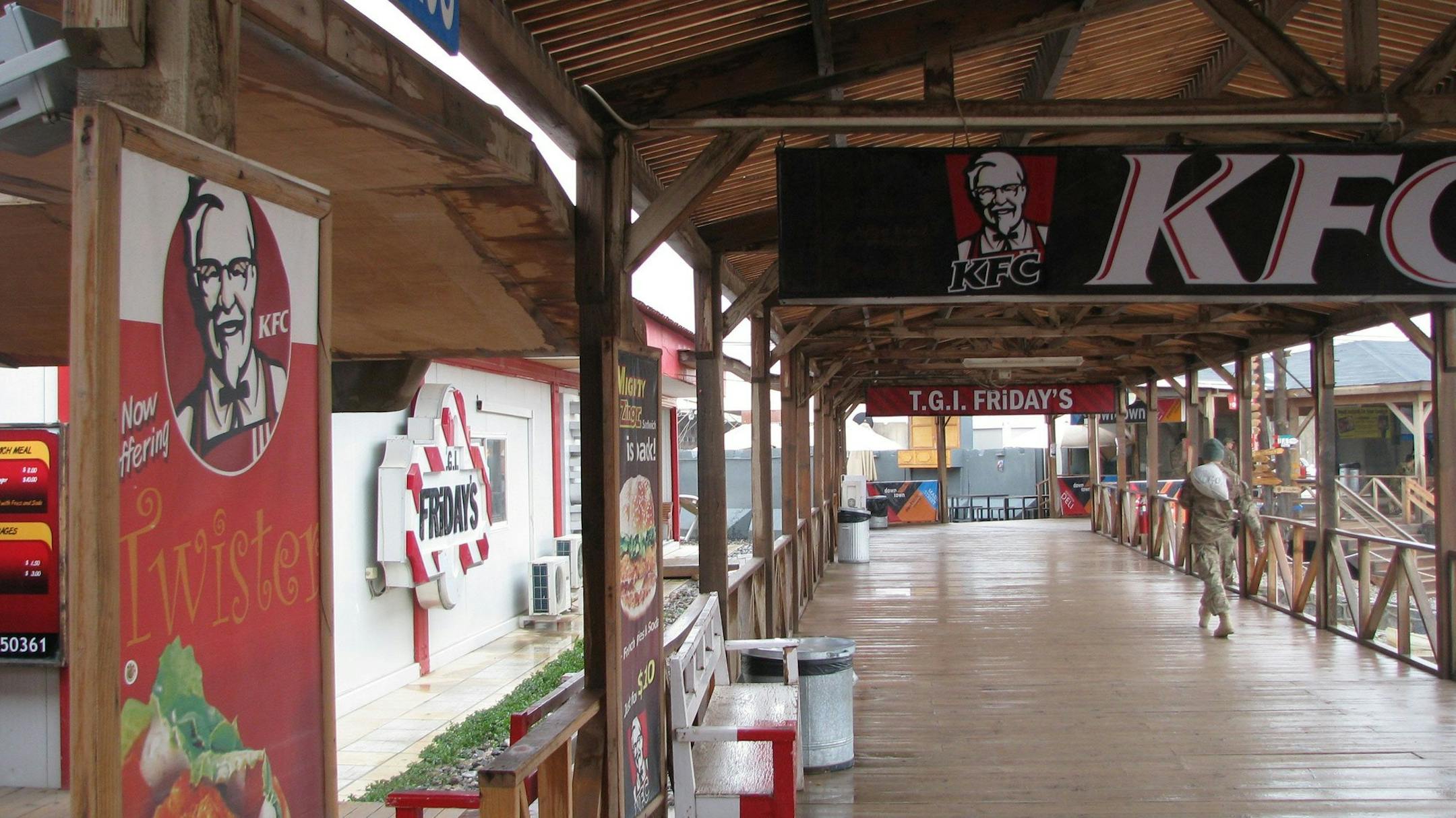 The Kandahar Airfield Boardwalk, for a decade the surreal yet comfortingly familiar heart of the biggest NATO base in Afghanistan, is closing.The festive, elevated rectangle of shops and fast-food vendors built around a small soccer field and running track,will be shut down in phases, beginning next month. (Jay Price/MCT) ORG XMIT: 2/1/2013 ORG XMIT: MIN1309111124571597