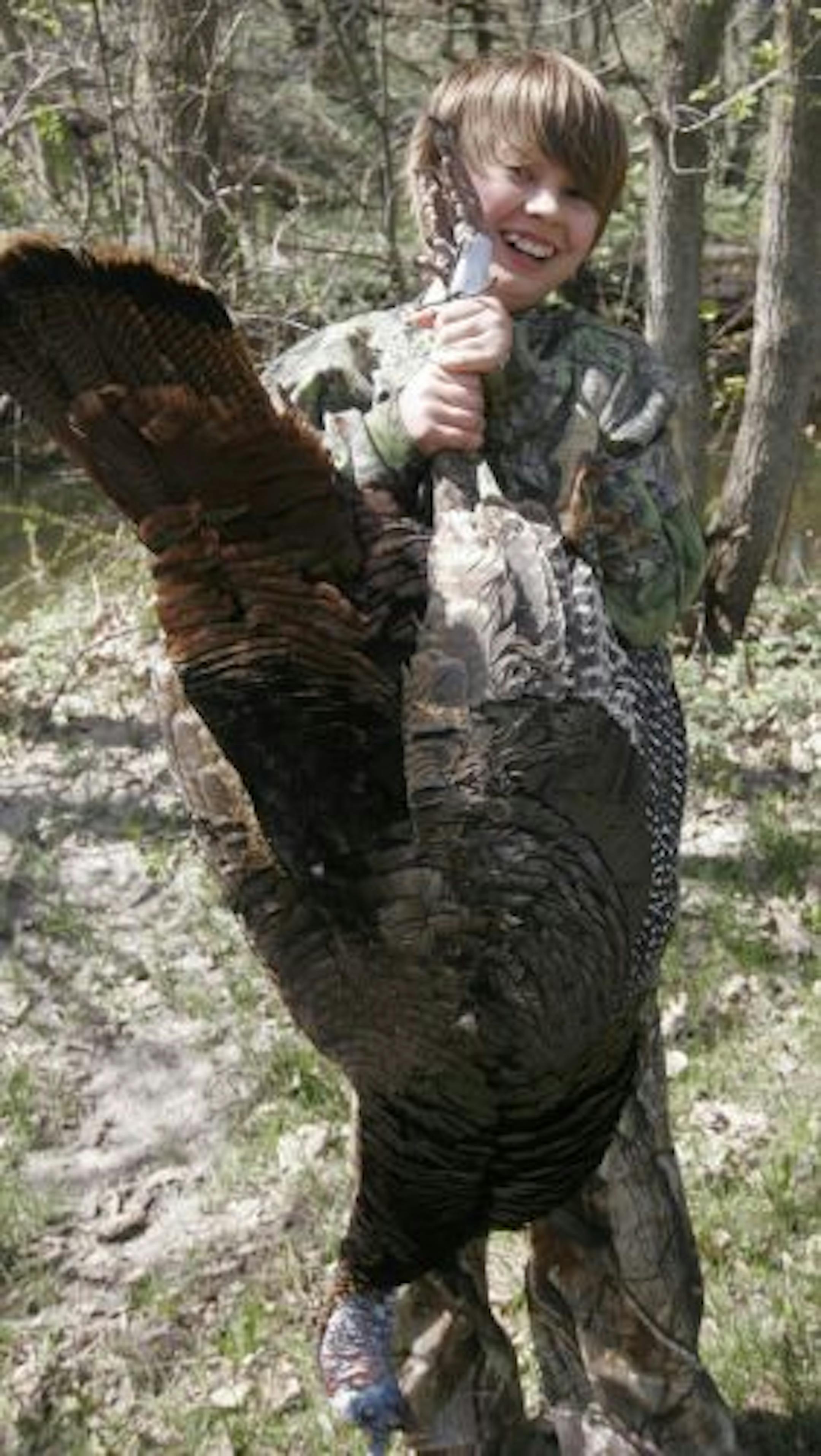 Reece DeVries, 12, of Minneapolis was all grins after bagging his first-ever wild turkey, a dandy 20-pound tom, in Minnesota's youth turkey hunt Saturday near Redwood Falls.