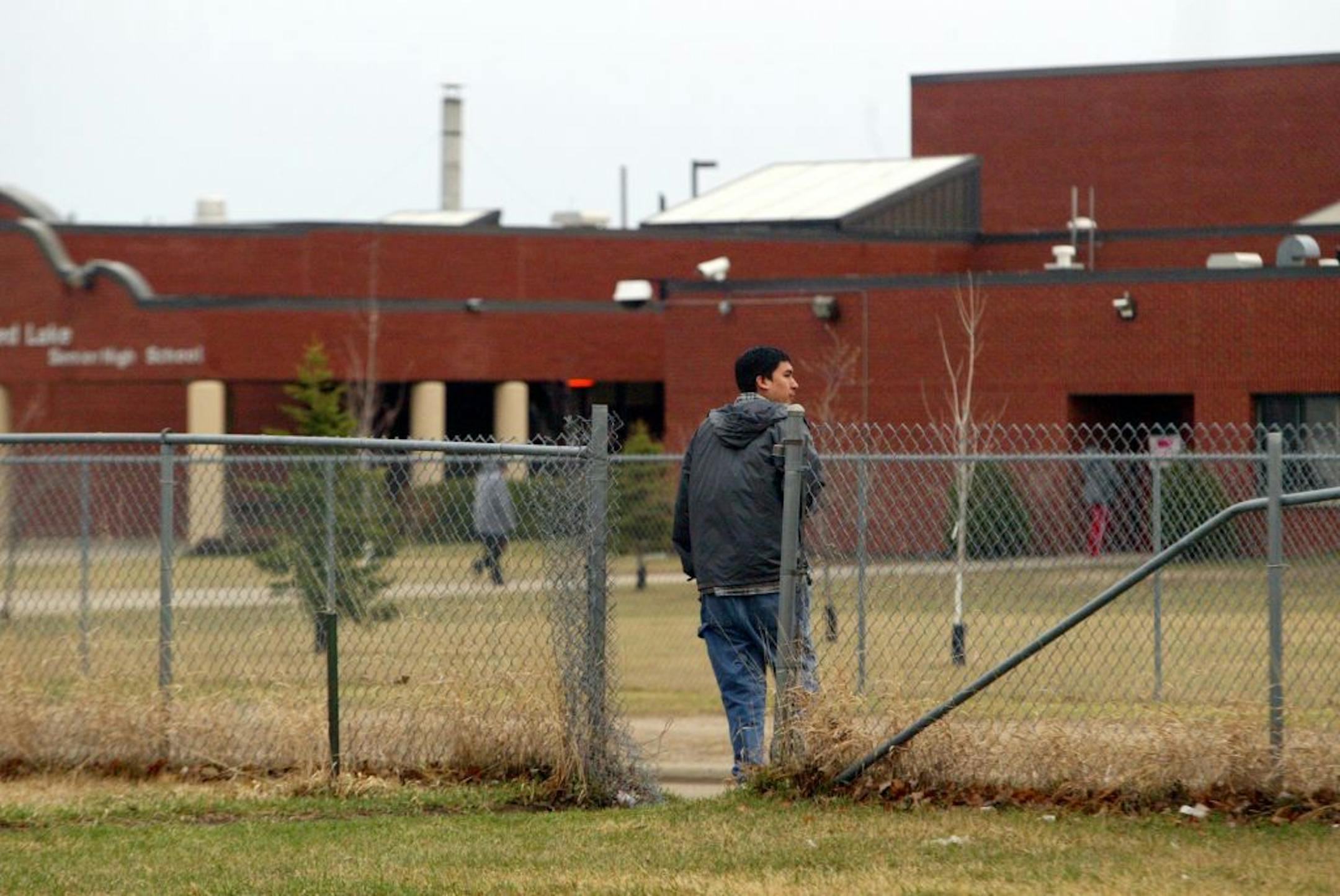 Renee Jones/Star Tribune 4/12/05 Red Lake, Minn. Josh Hunter, 17, walks from his house to school on the first day back at Red Lake High School after the school shooting.
