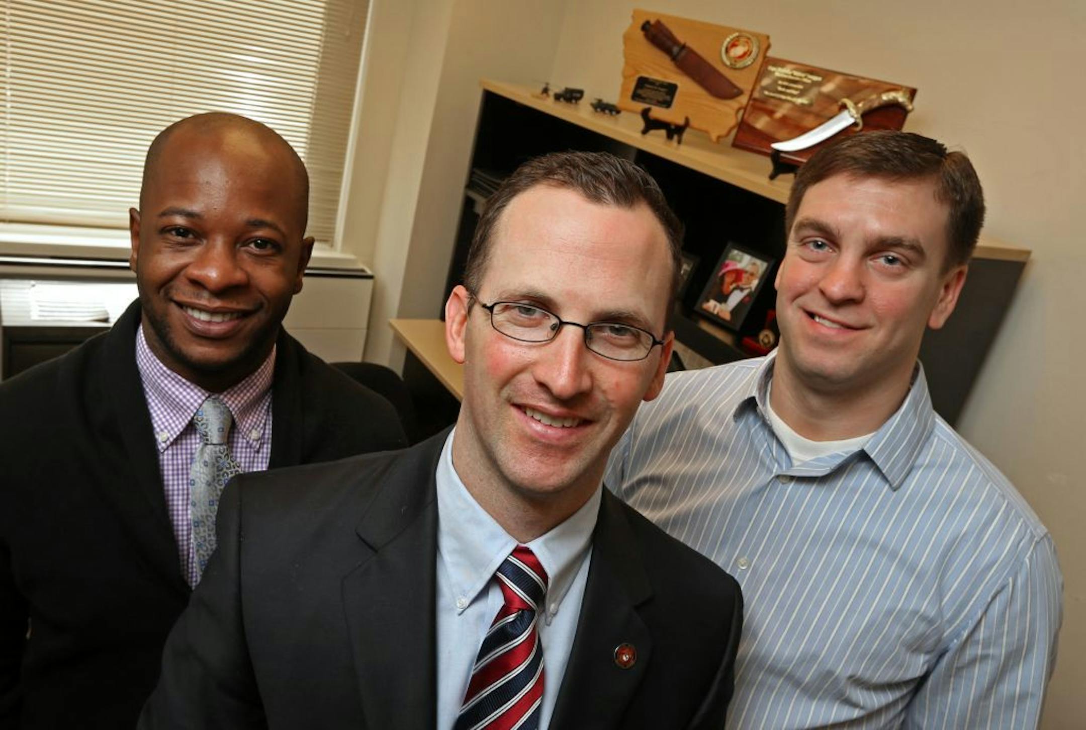 (left to right) Genesis 10's Kyle Marks, account coordinator, Nick Swaggert, director of Veteran's hiring and Josh Stinar, business consultant were photographed on 1/29/14. Nick Swaggert enlisted in the Marines while a senior at Blake High School in 1999, attended college on a Marine scholarship and, retired from active duty in 2010 following tours of duty in Iraq and Afghanistan. Swaggert, an infantry officer who best remembers winning over local tribal leaders in Iraq's El Anbar Province durin