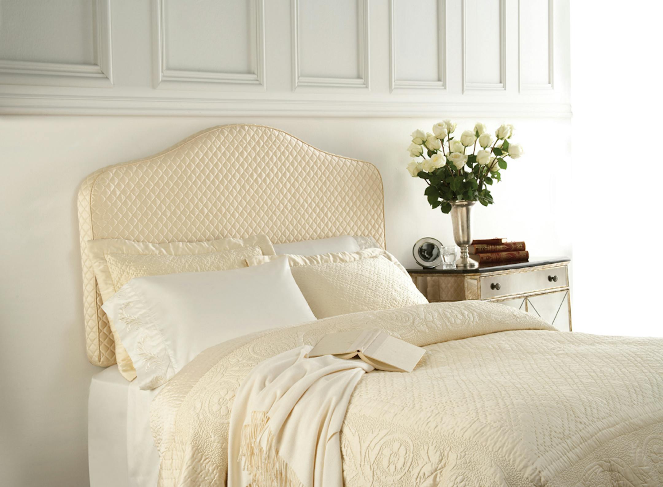 The inflatable air cushion and upholstered slipcover attaches to the wall behind a bed to create an instant headboard.
