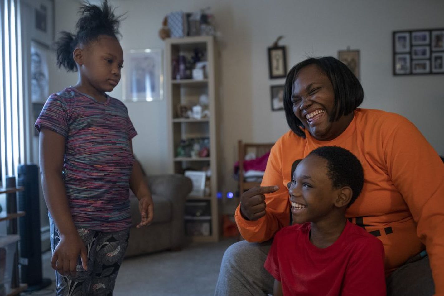 Jacinta Moss and her son Malachi, 9, and daughter A'Zaynia, 6 played at their apartment Thursday, June 18, in St. Paul.