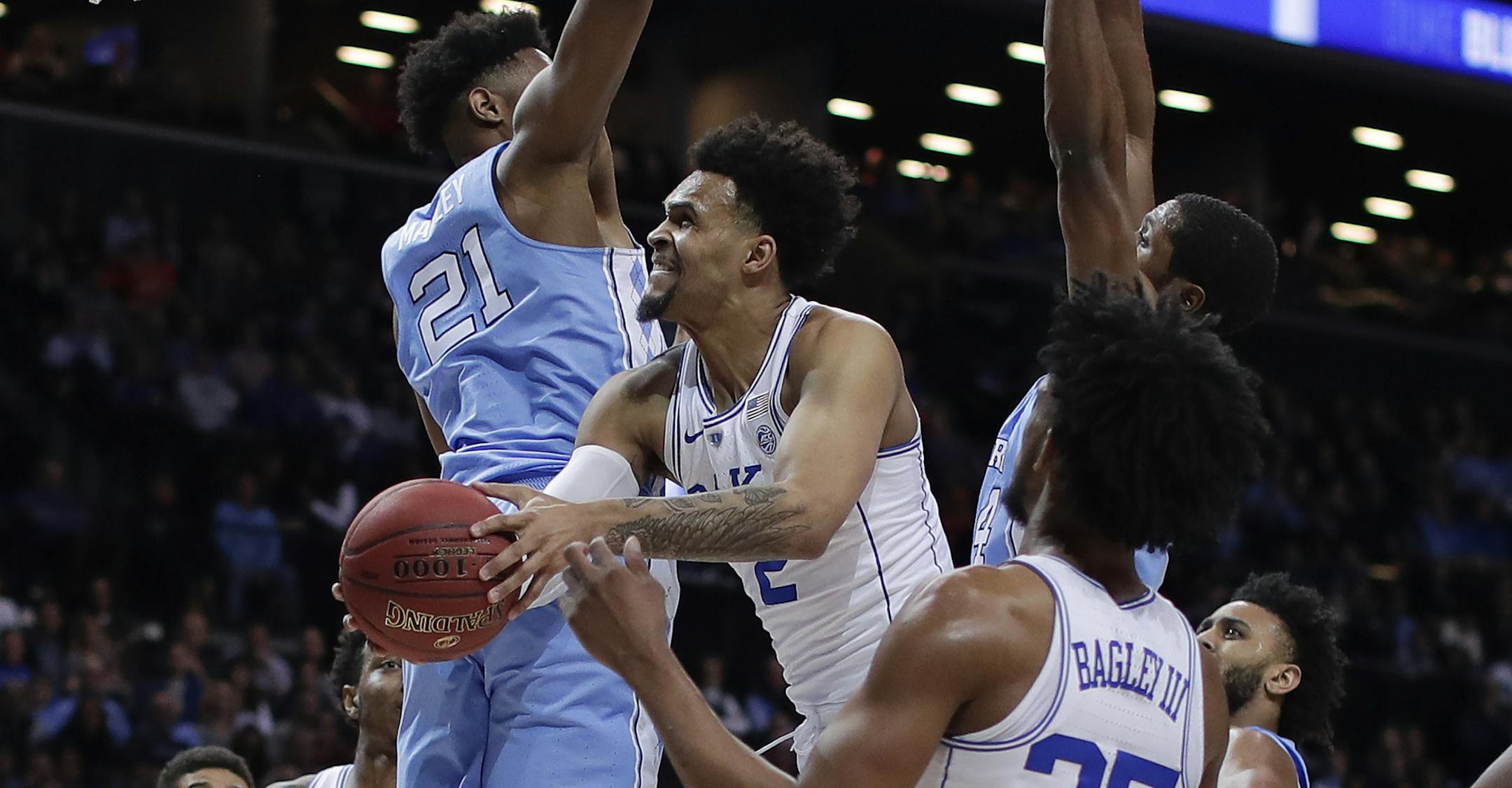 Duke guard Gary Trent Jr. (2) goes up for a shot against North Carolina forward Sterling Manley (21) during the second half of an NCAA college basketball game in the Atlantic Coast Conference men's tournament semifinals Friday, March 9, 2018, in New York. North Carolina won 74-69. (AP Photo/Julie Jacobson)