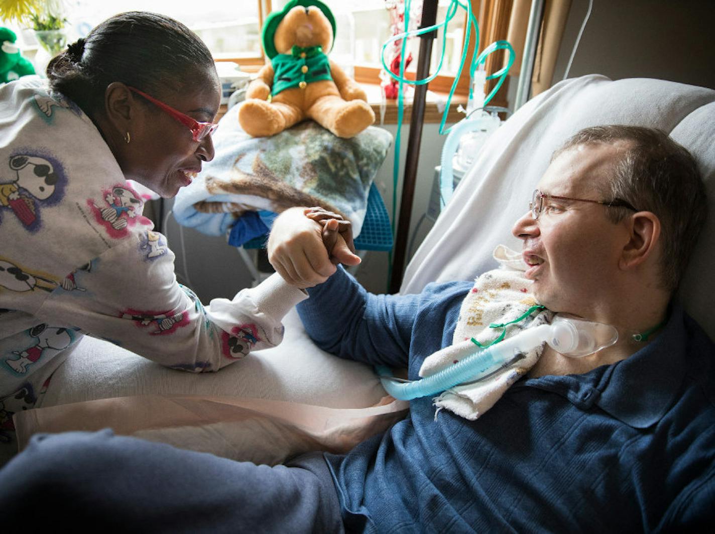 Personal care attendandt (PCA) Nora Clark playfully arrm wrestled Scott Semo after helping him eat, exercise and with other tasks at his home in Roseville in 2017.
Semo needed assistance every day after suffering a brain hemorrhage years earlier. More than 40,000 indigent Minnesotans get at-home care through state-federal Medicaid that allows them to live at home instead of in an institution. Star Tribune file photo