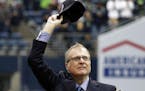 In this Sept. 17, 2017 photo, Seattle Seahawks owner Paul Allen waves as he is honored for his 20 years of team ownership before an NFL football game 
